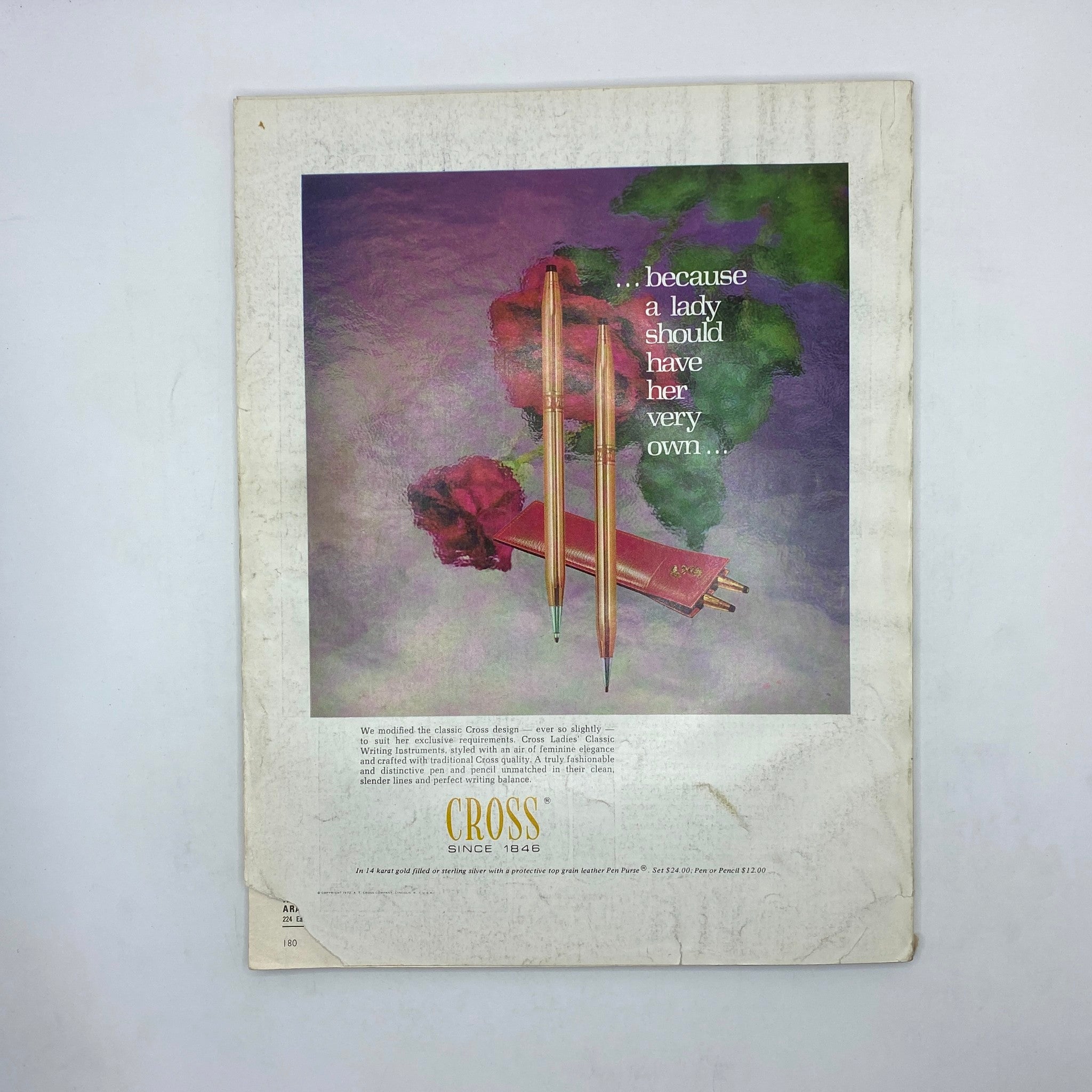 Back cover of the VTG Vogue Magazine May 1972 featuring a luxury pen advertisement by Cross, showcasing elegant design elements and a floral background.
