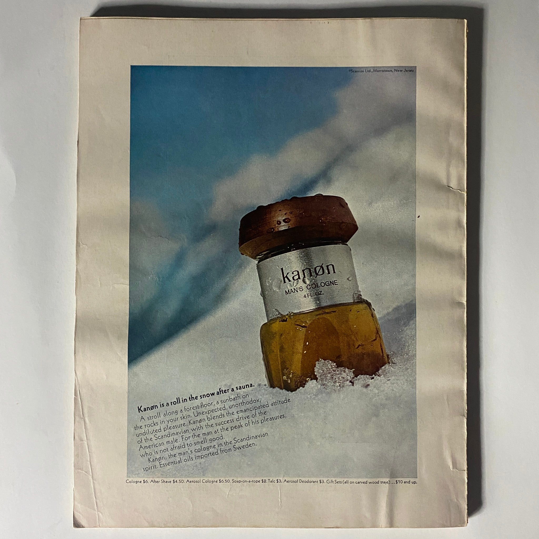 Vogue Magazine November 15, 1967 featuring Twiggy with an advertisement for Kanon Men's Cologne, showcasing a bottle placed in snow with a captivating winter backdrop.