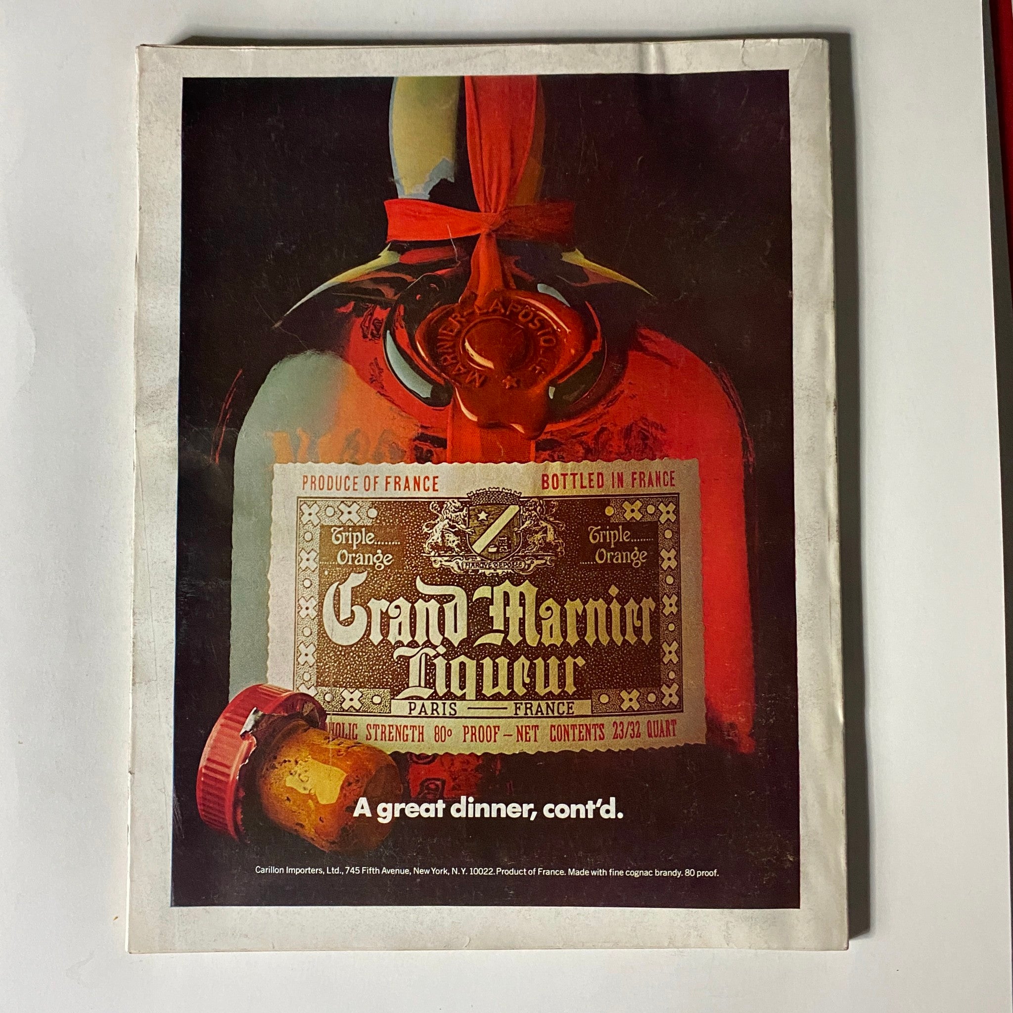 Back cover of VTG Vogue Magazine February 1976 featuring an advertisement for Grand Marnier liqueur, reflecting the marketing aesthetics of the time.