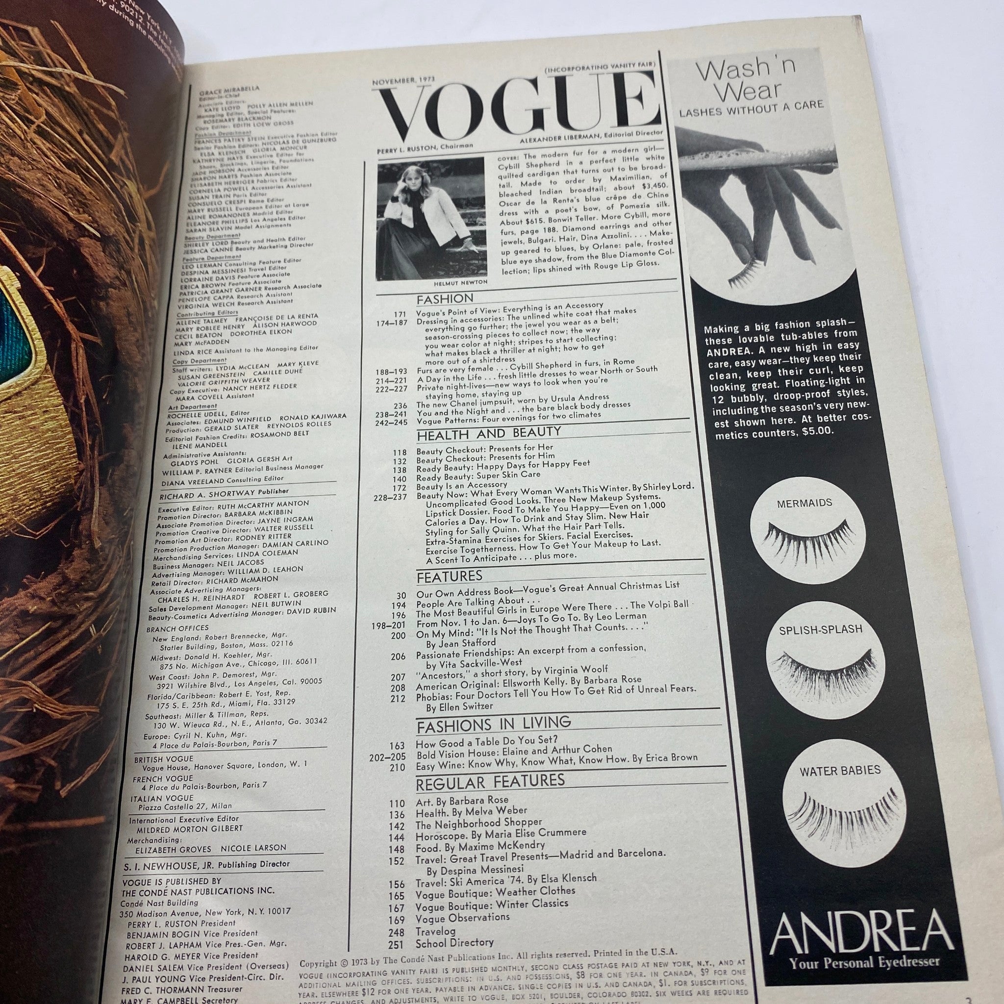 Table of contents page from VTG Vogue Magazine November 1973 featuring numerous fashion and beauty articles, with a striking image of a model on the side, showcasing the contents of the issue.