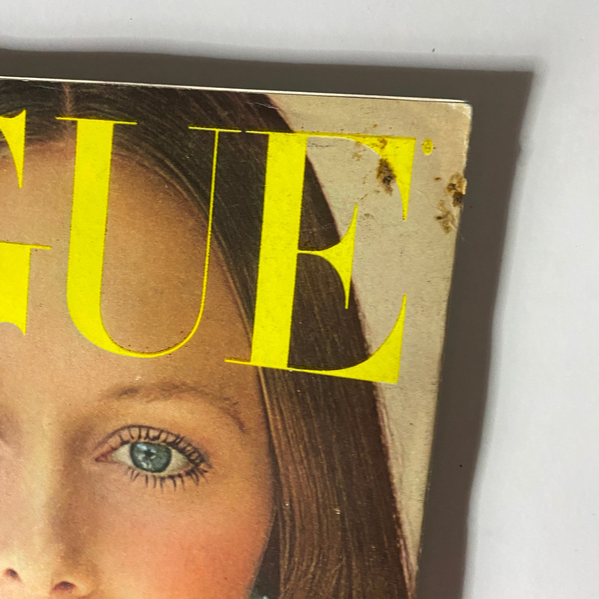 Close-up view of the VTG Vogue Magazine April 1973 cover, highlighting the prominent 'VOGUE' text and Karen Graham's captivating gaze.