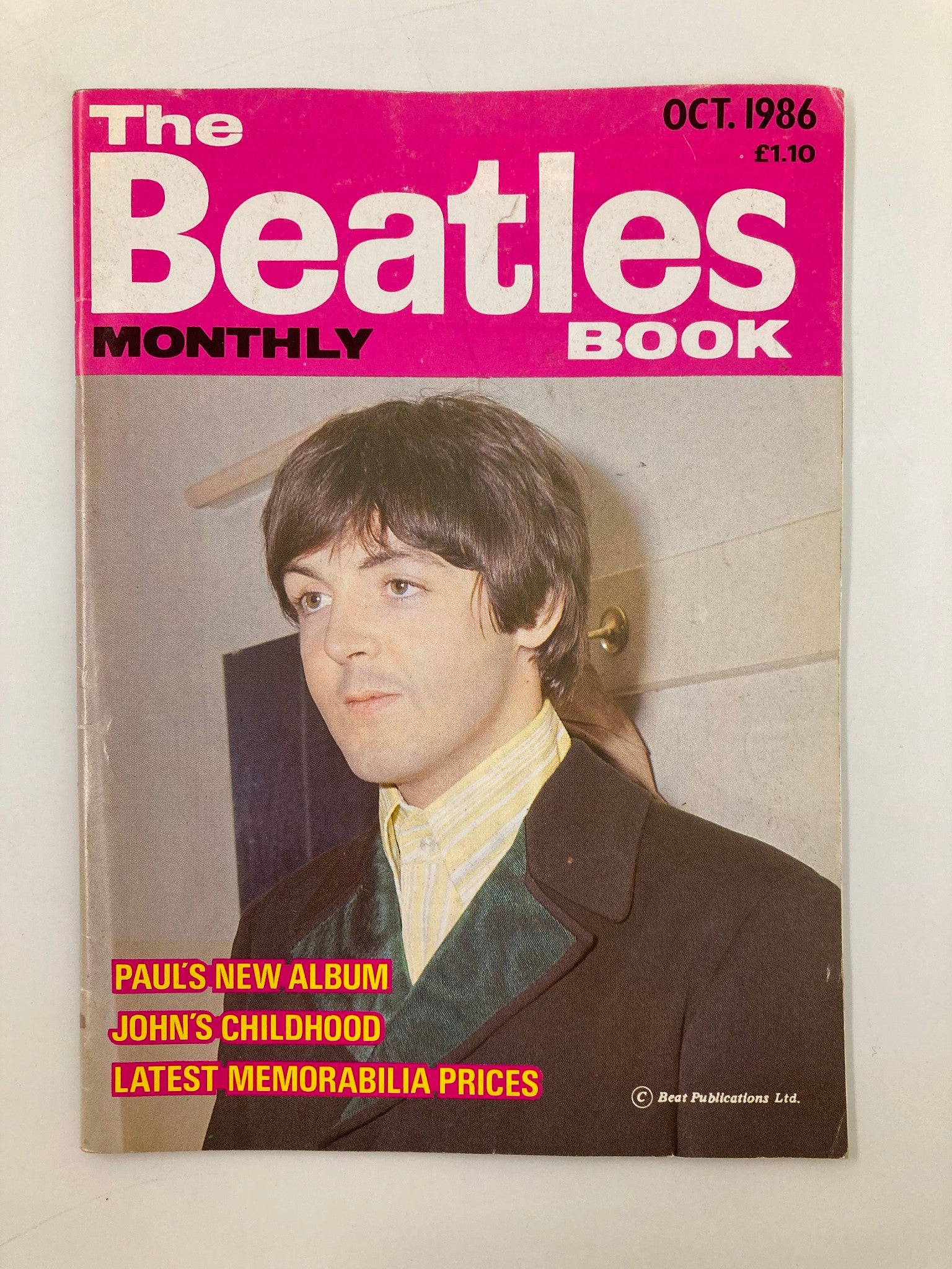 Cover of The Beatles Book Monthly Magazine October 1986 #126 featuring Paul McCartney, highlighting articles on his new album, John Lennon's childhood, and memorabilia prices.