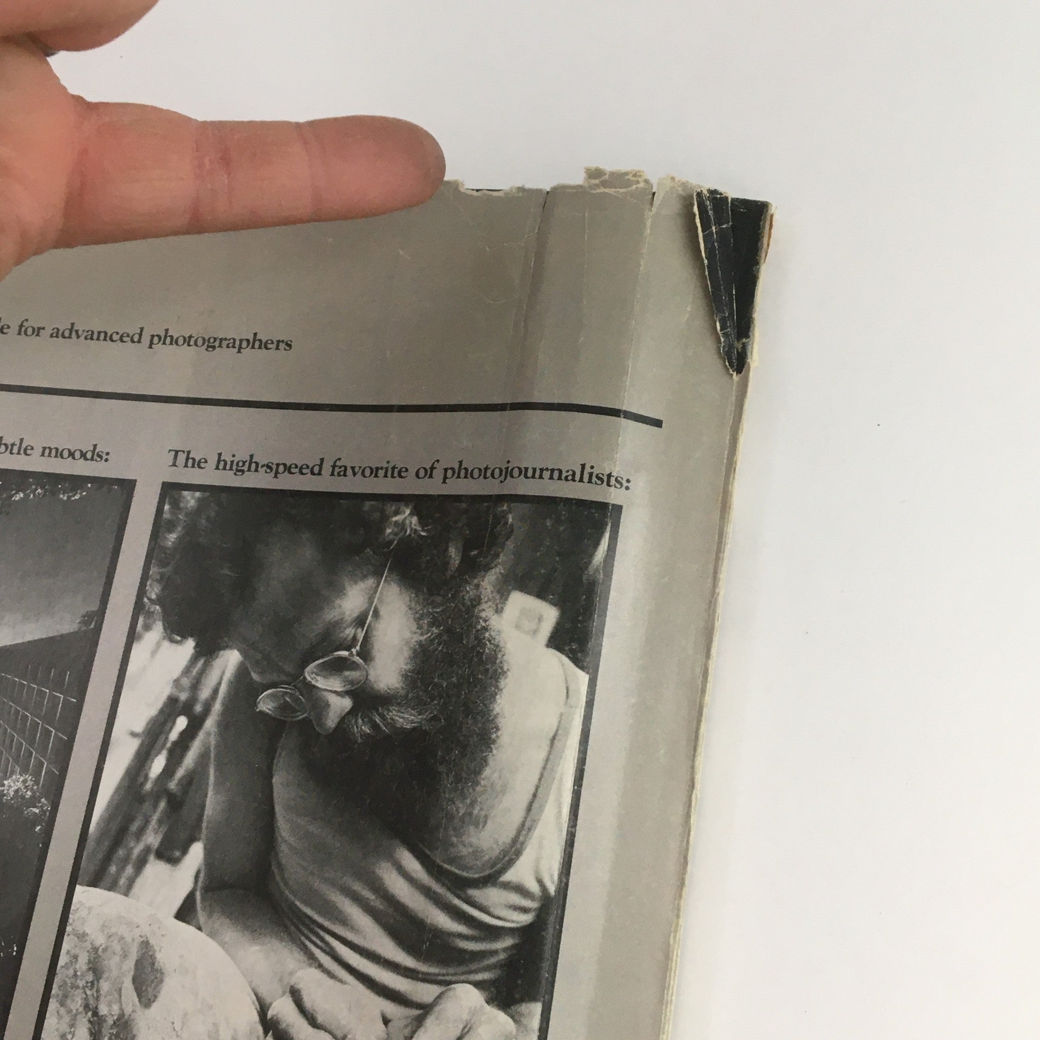 Close-up of the back cover of Petersen's Photographic November 1979 showing a slight rip and wear, emphasizing its vintage appeal as a collectible item.