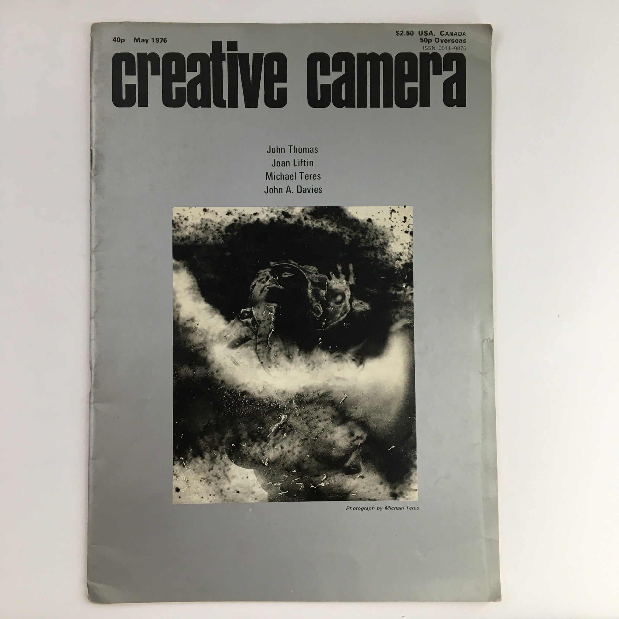 Cover of Creative Camera Magazine May 1976 featuring a photograph by Michael Teres. The cover showcases the title in bold typography with additional text listing contributors, embodying vintage design aesthetics.