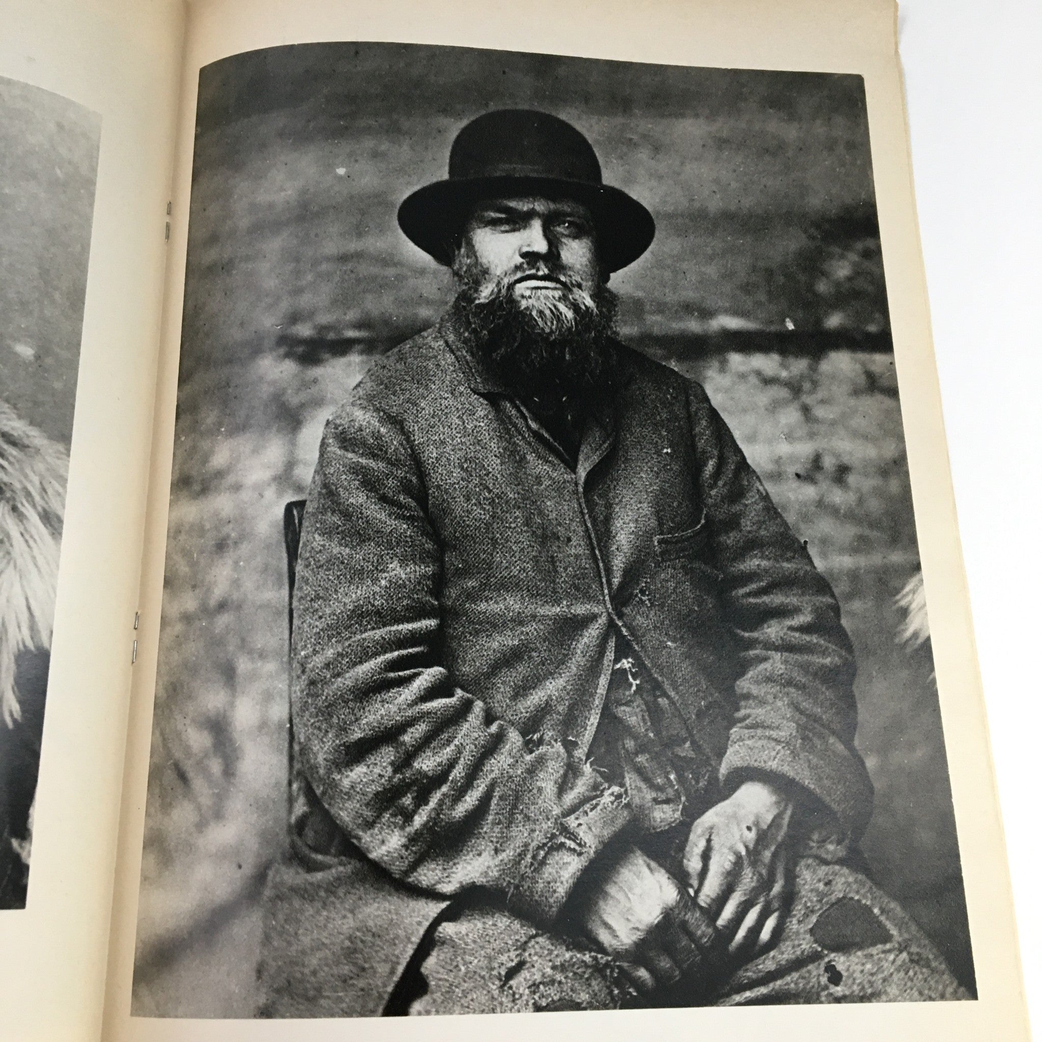 Vintage portrait featured in Creative Camera Magazine May 1976, showcasing a man dressed in early 20th-century clothing. The photograph emphasizes traditional portraiture techniques, reflecting the era's photographic history.