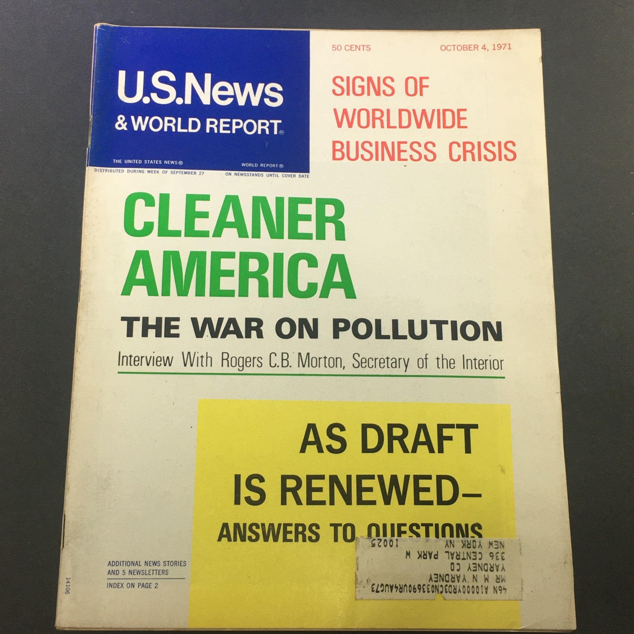 Vintage U.S. News & World Report Magazine from October 4, 1971, featuring the title 'Cleaner America: The War on Pollution,' with an interview of Secretary of the Interior Rogers C.B. Morton. The cover displays prominent text about a worldwide business crisis and includes a yellow address label.