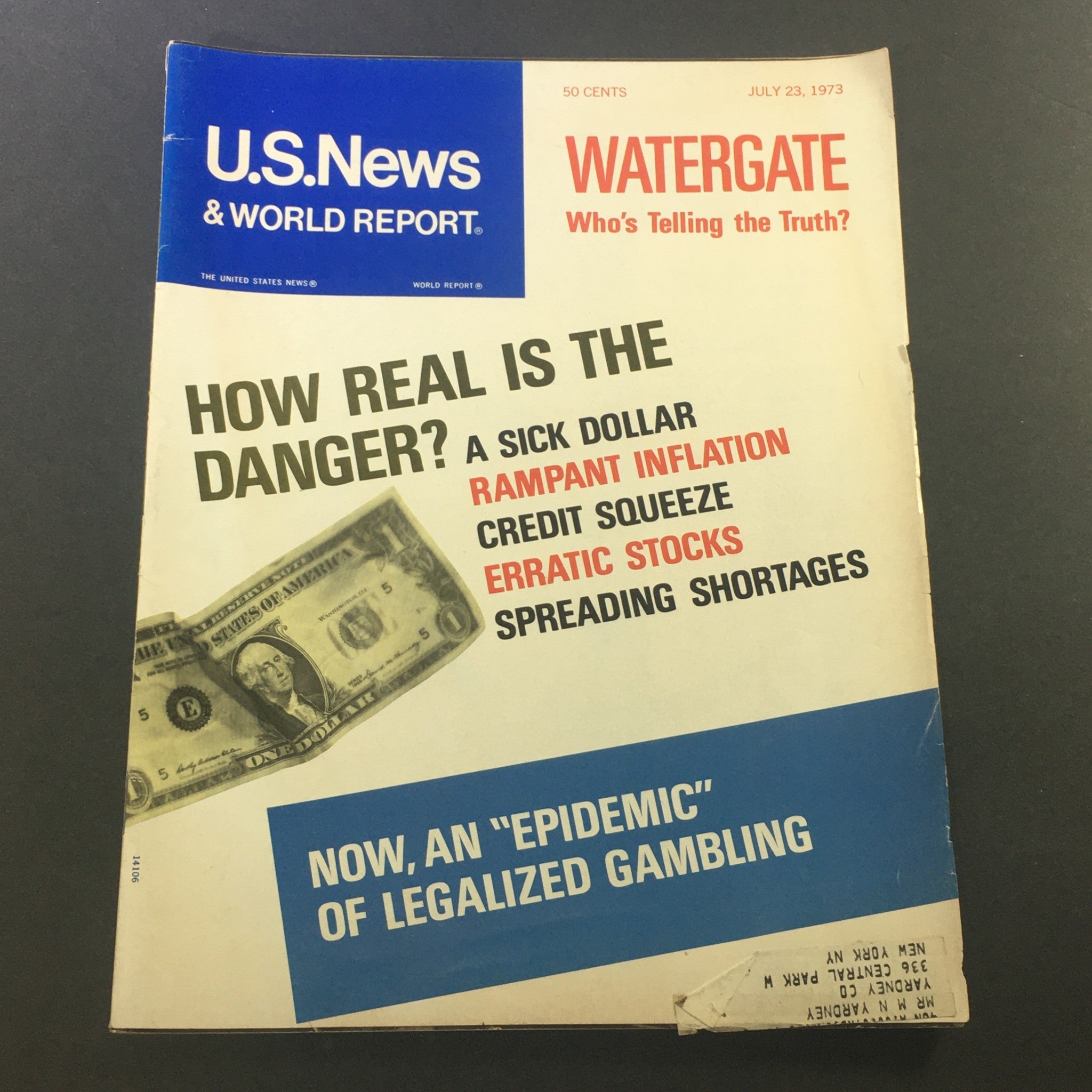 Cover of VTG U.S. News & World Report Magazine from July 23, 1973, featuring the headline 'Watergate: Who's Telling the Truth?' alongside a depiction of a one-dollar bill, highlighting themes of inflation and economic concerns from that era.