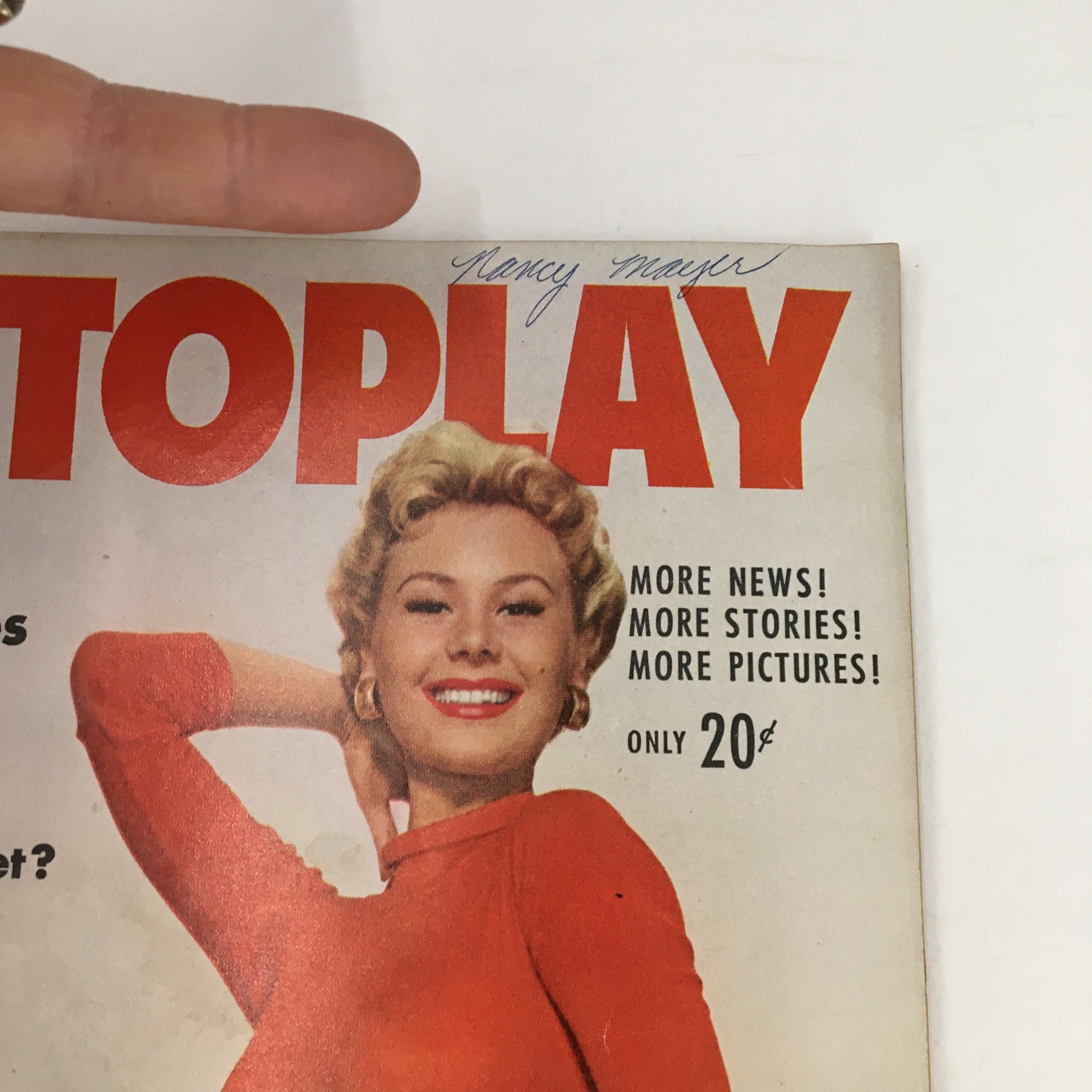 Close-up of the Photoplay Magazine May 1956 cover highlighting the bright colors and classic design, showcasing Mitzi Gaynor's charming smile.