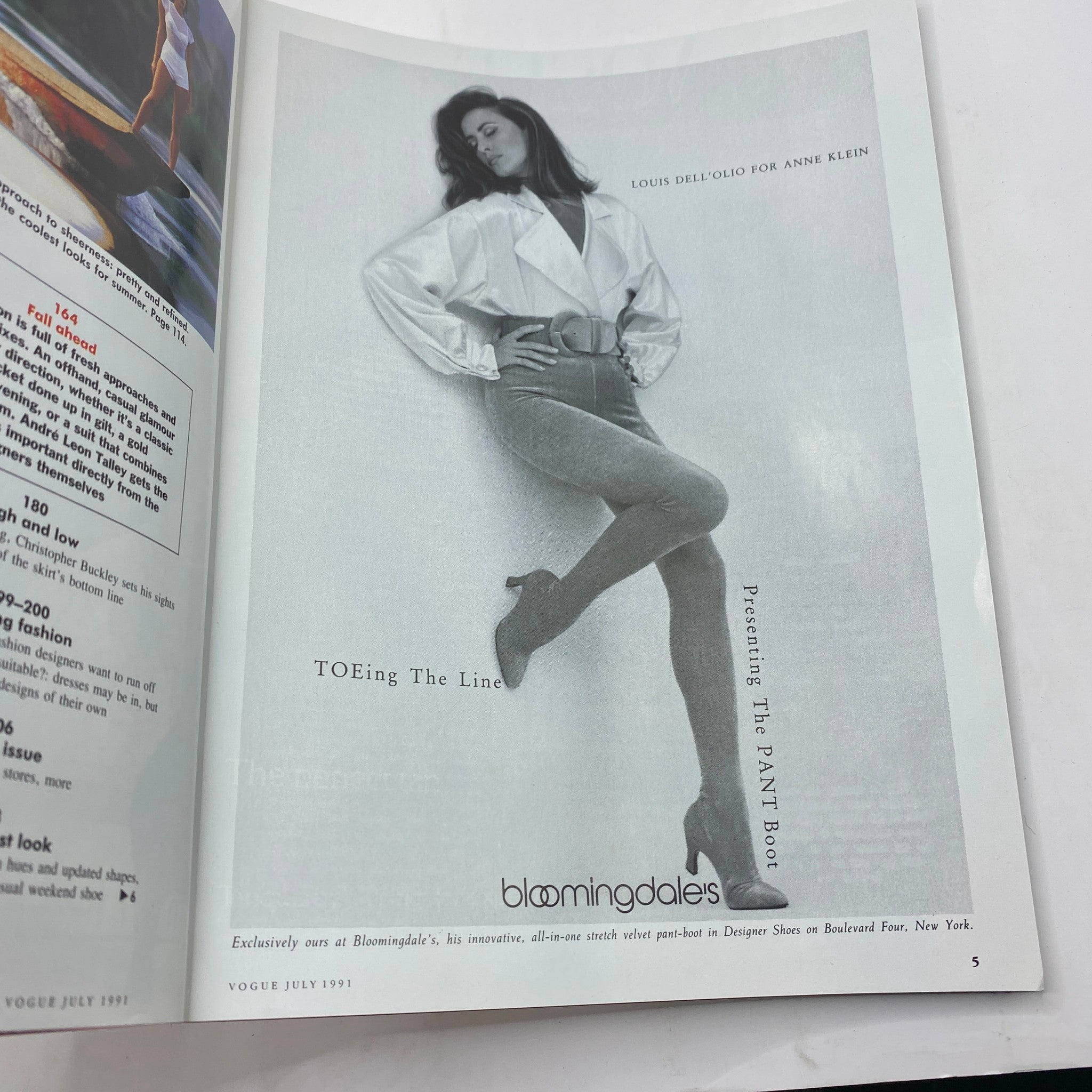 Inside page of Vogue Magazine July 1991 displaying a black and white photo of a model in a stylish outfit with a belt. This article features the iconic styles of the early '90s.