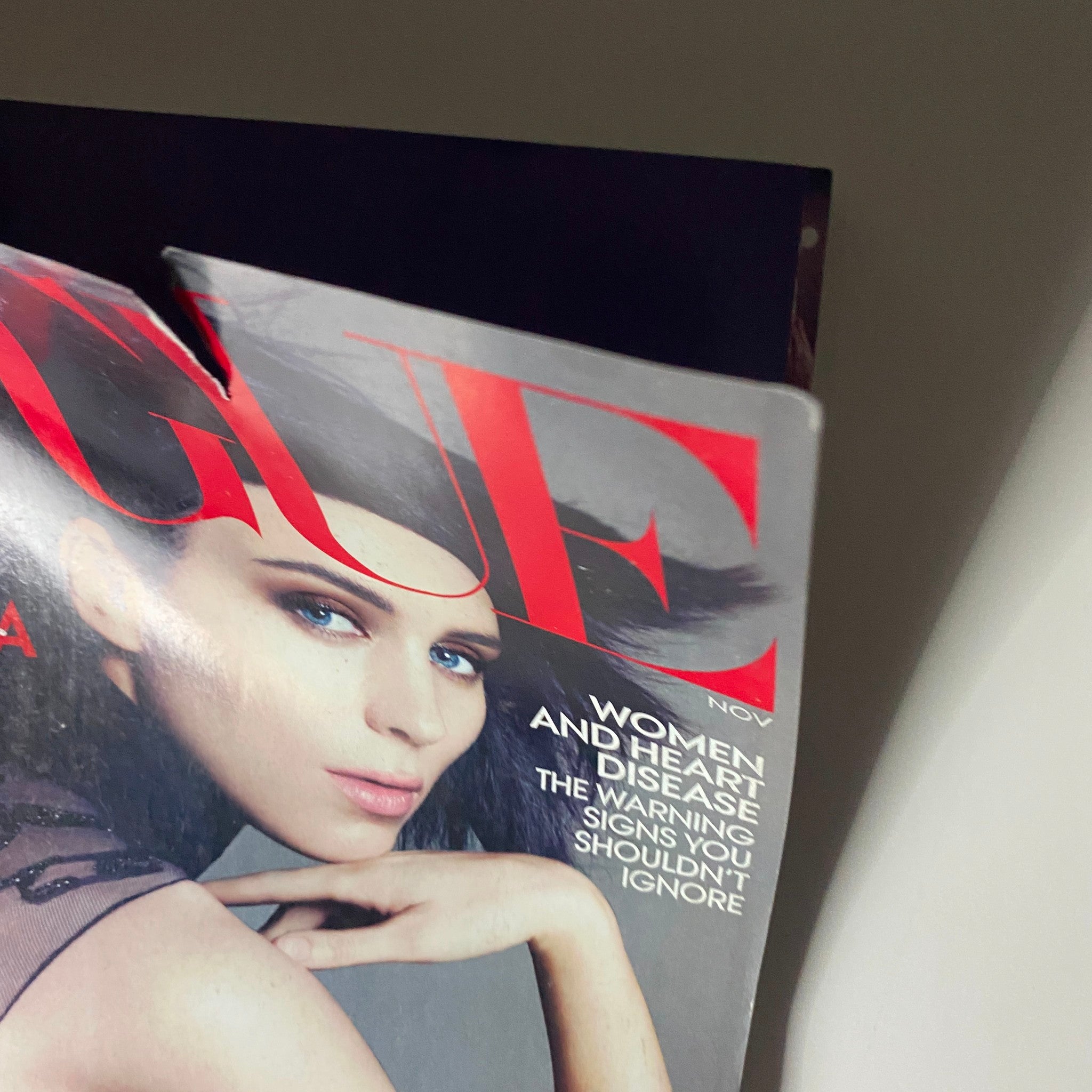 Close-up of Vogue Magazine November 2011 cover with Rooney Mara, highlighting her striking features and fashion statement.