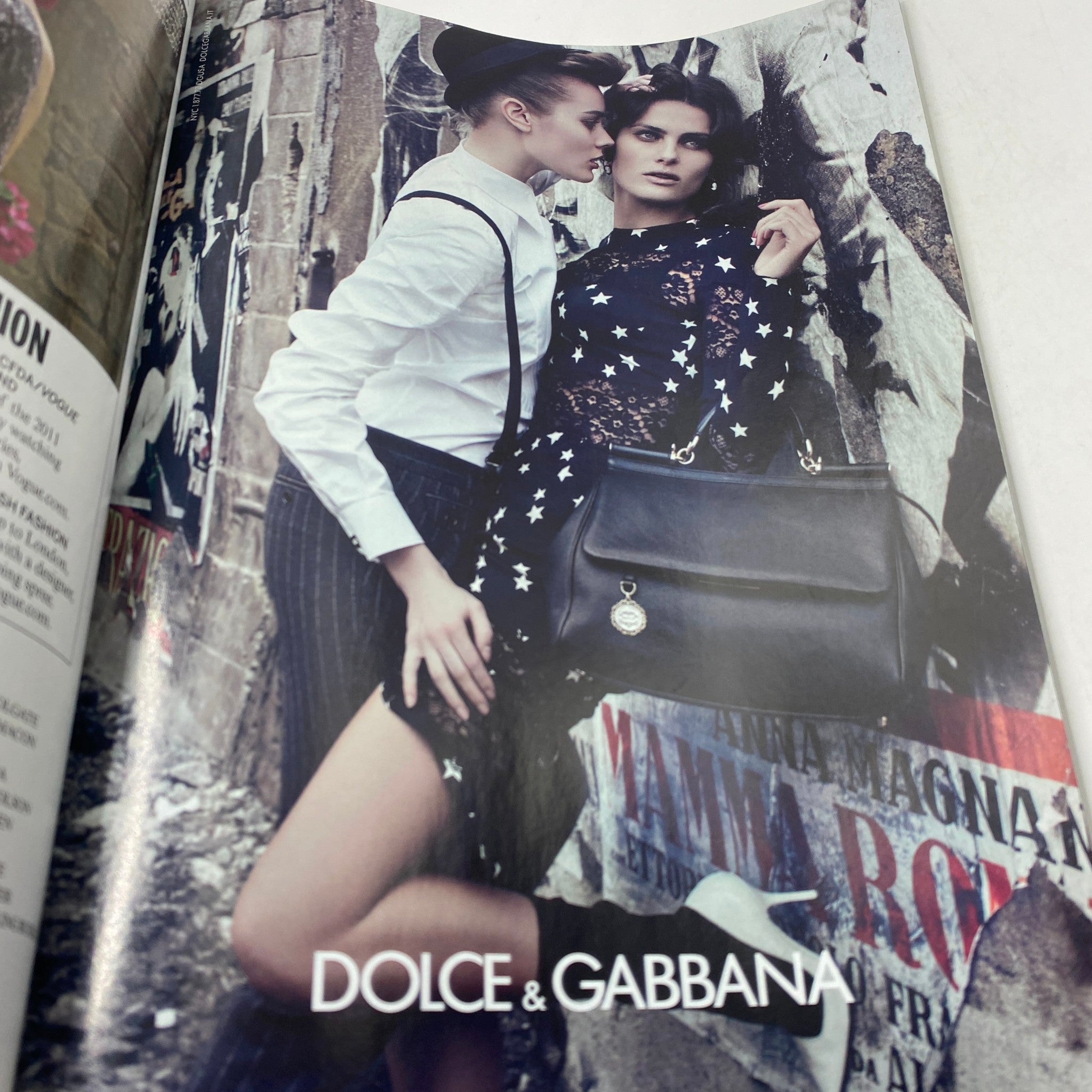 Fashion advertisement featuring Dolce & Gabbana models in a dramatic setting from Vogue Magazine November 2011 with Rooney Mara on the cover.