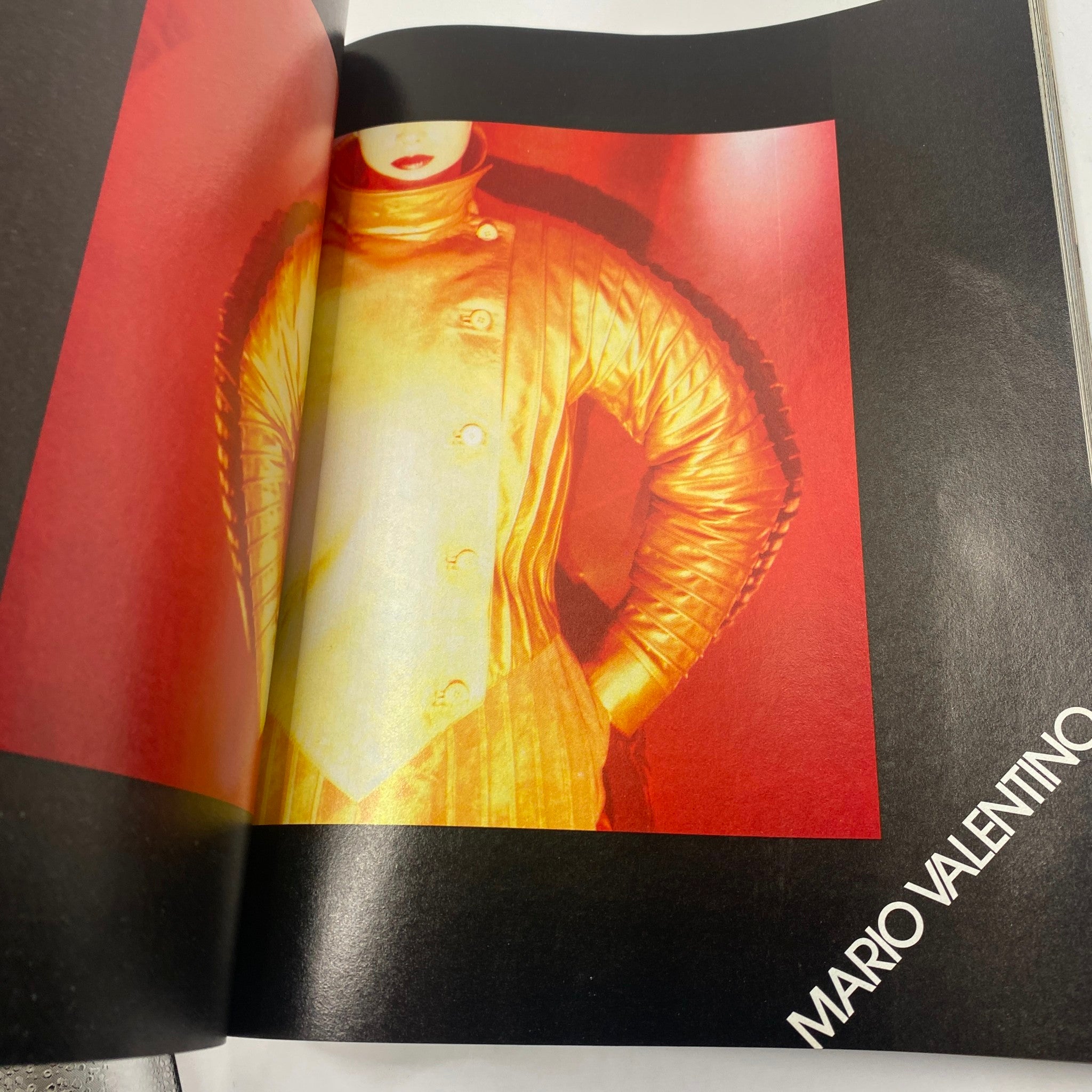 Fashion editorial spread from October 1981 Vogue Magazine highlighting a striking Mario Valentino outfit with vibrant colors.