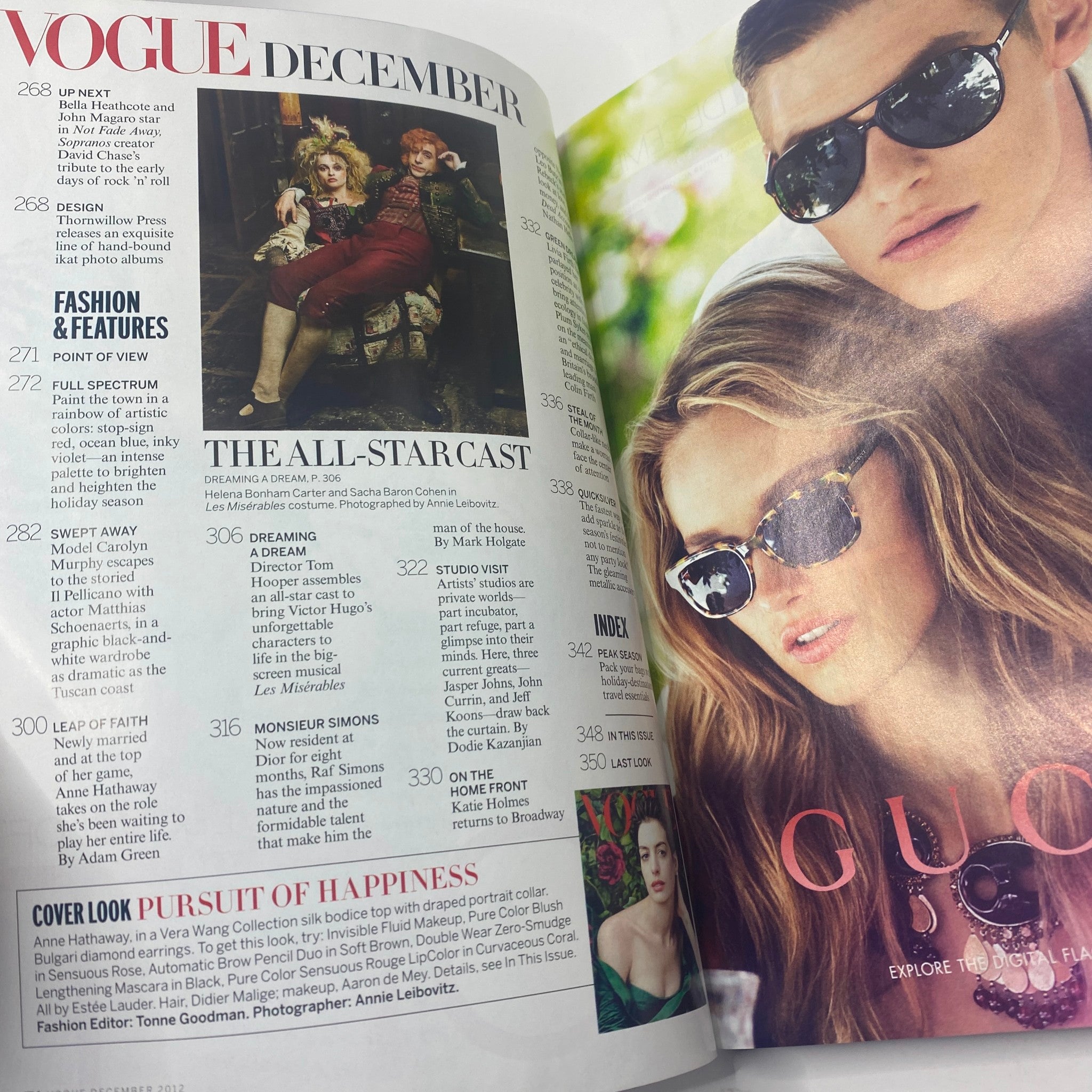 Inside page of Vogue Magazine December 2012, highlighting articles and ads, featuring Anne Hathaway and other fashion pieces.