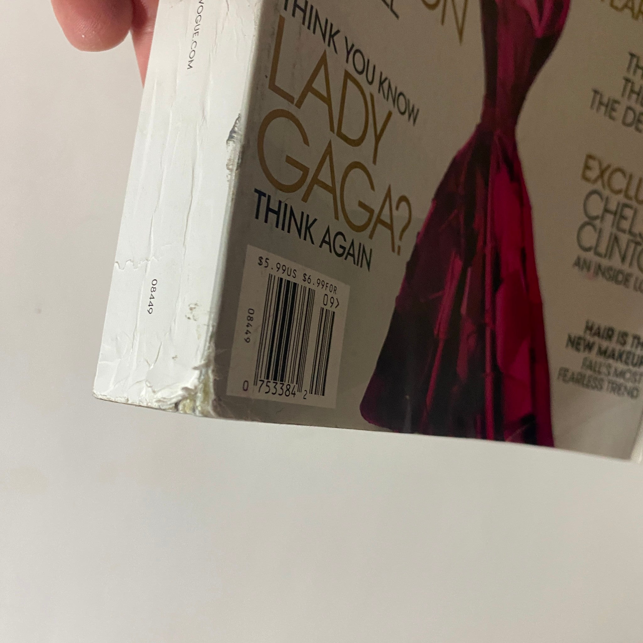 Side view of the Vogue Magazine September 2012 showcasing wear and tear at the bottom corner, with the barcode visible, portraying its vintage nature.