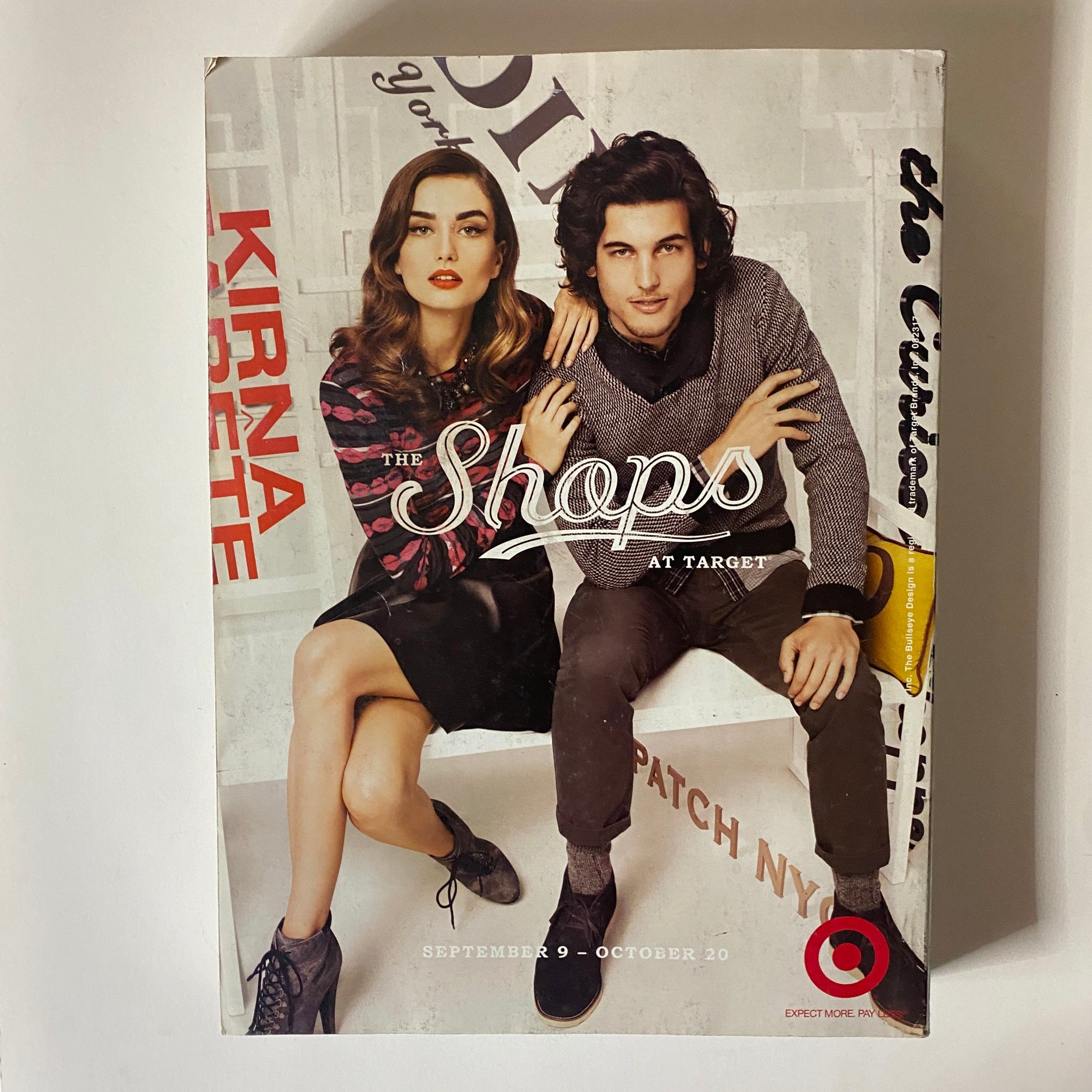 Cover feature of 'The Shops' at Target from Vogue Magazine September 2012, featuring a stylish couple posing together, promoting a collection available at Target, highlighting accessible fashion.