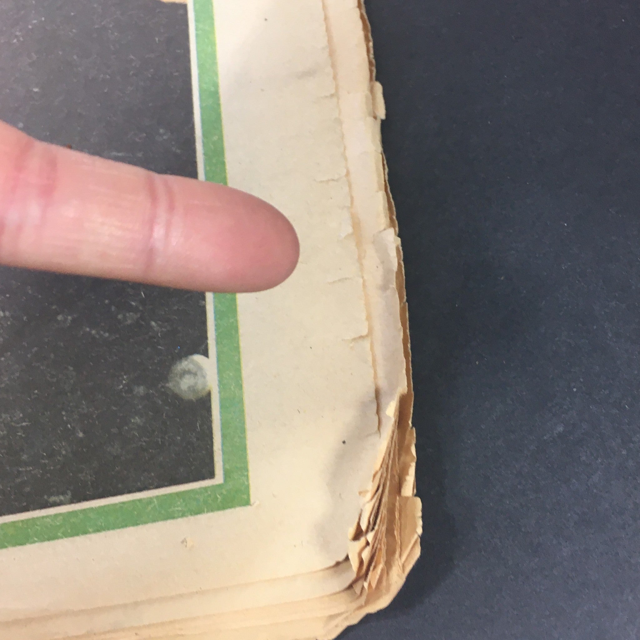 Close-up of the edge of the VTG Rolling Stone Magazine May 9, 1974 showing signs of wear and age on the cover.