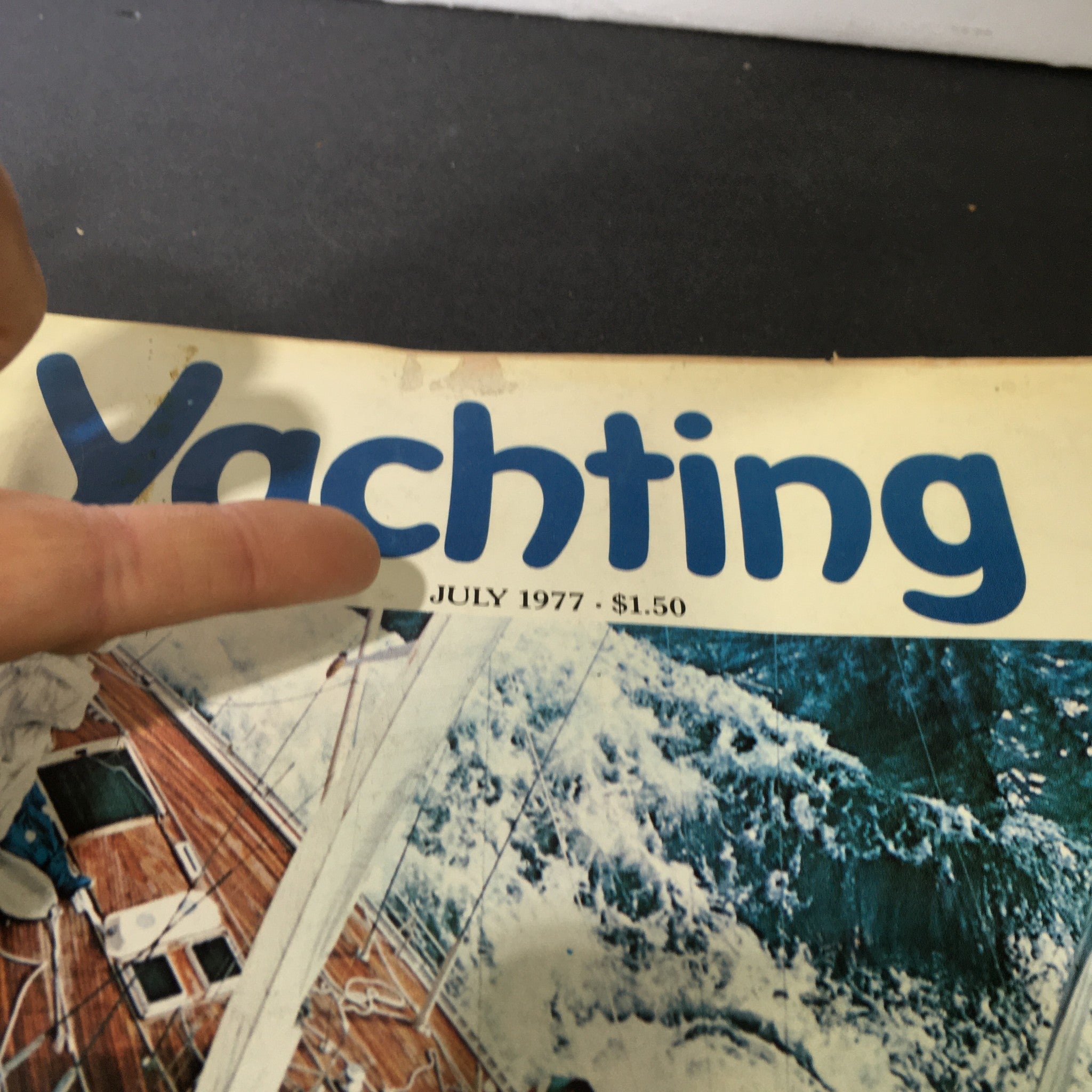 Close-up of the Yachting Magazine July 1977 title, showcasing the vintage lettering and highlighting the publication's focus on sailing adventures.