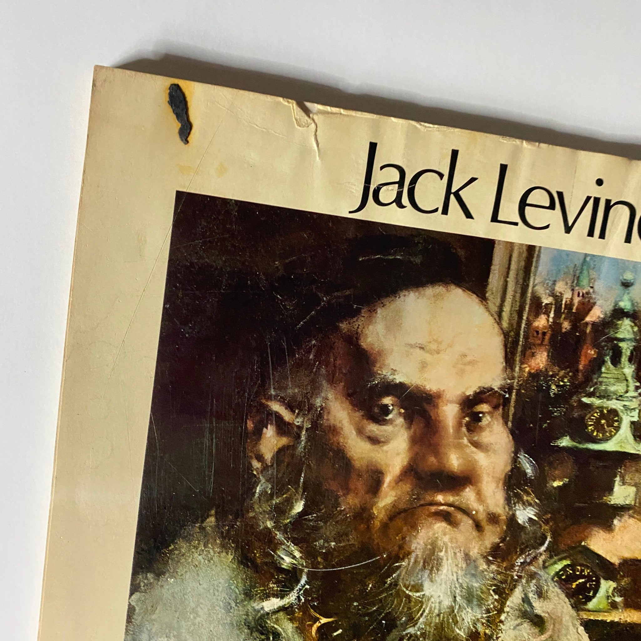 Close-up view of the cover of 'Jack Levine' magazine, focusing on the portrait of a rabbi, with detailed textures and title prominently displayed.