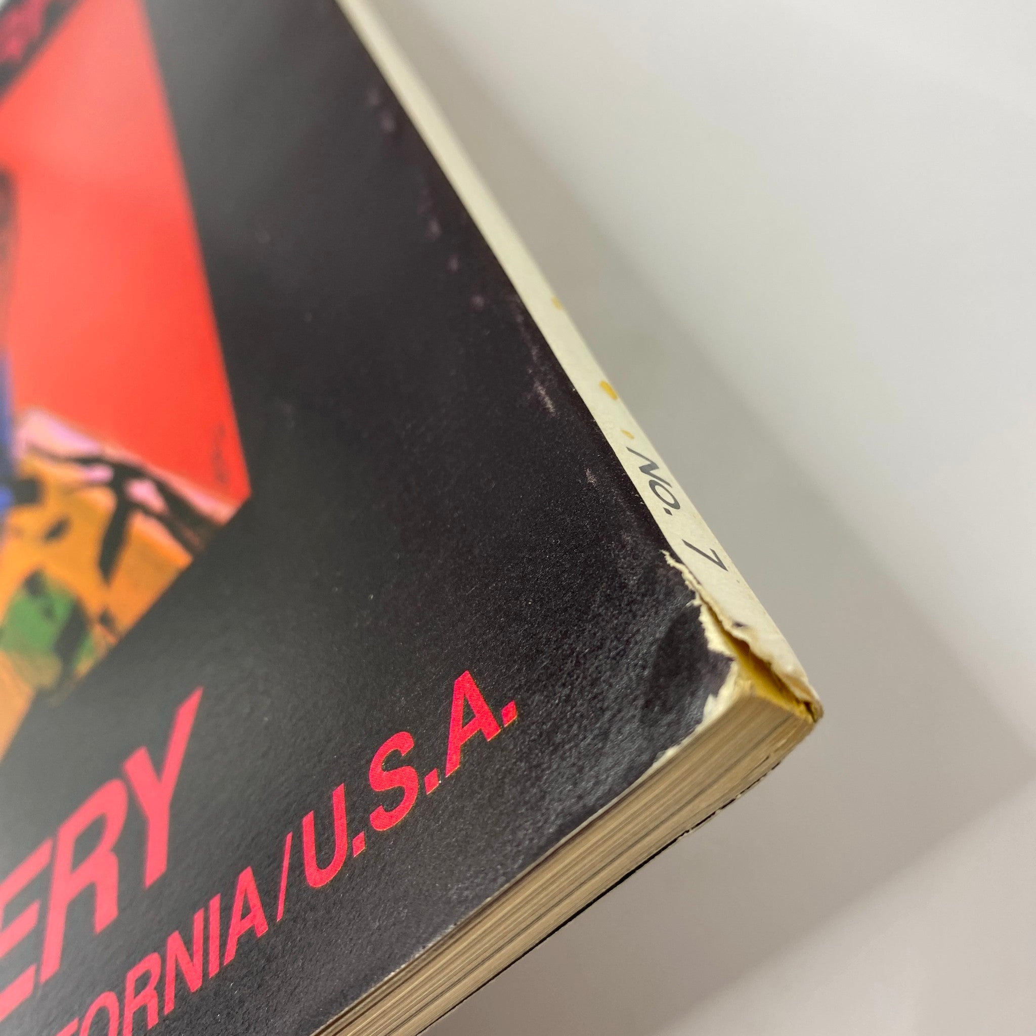 Detailed view of the spine of the Art in America Magazine November 1979, highlighting wear and condition, with focus on the text and edges.