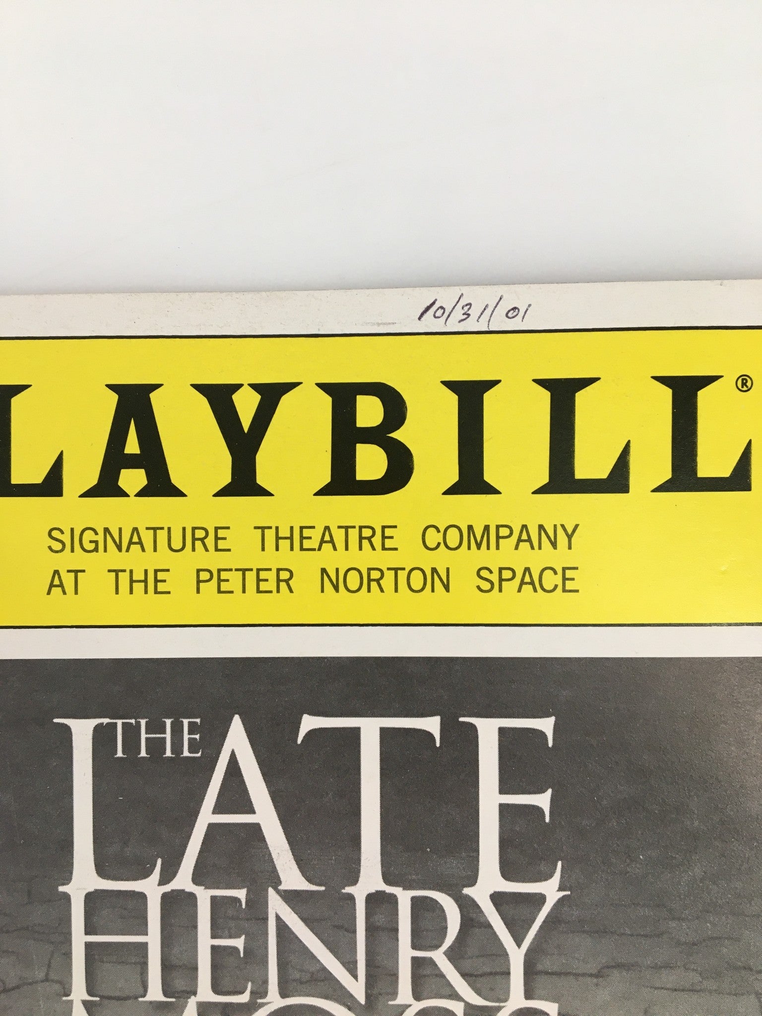 Close-up of the 2001 Playbill for The Late Henry Moss, highlighting the Signature Theatre Company logo with a date inscribed at the top.