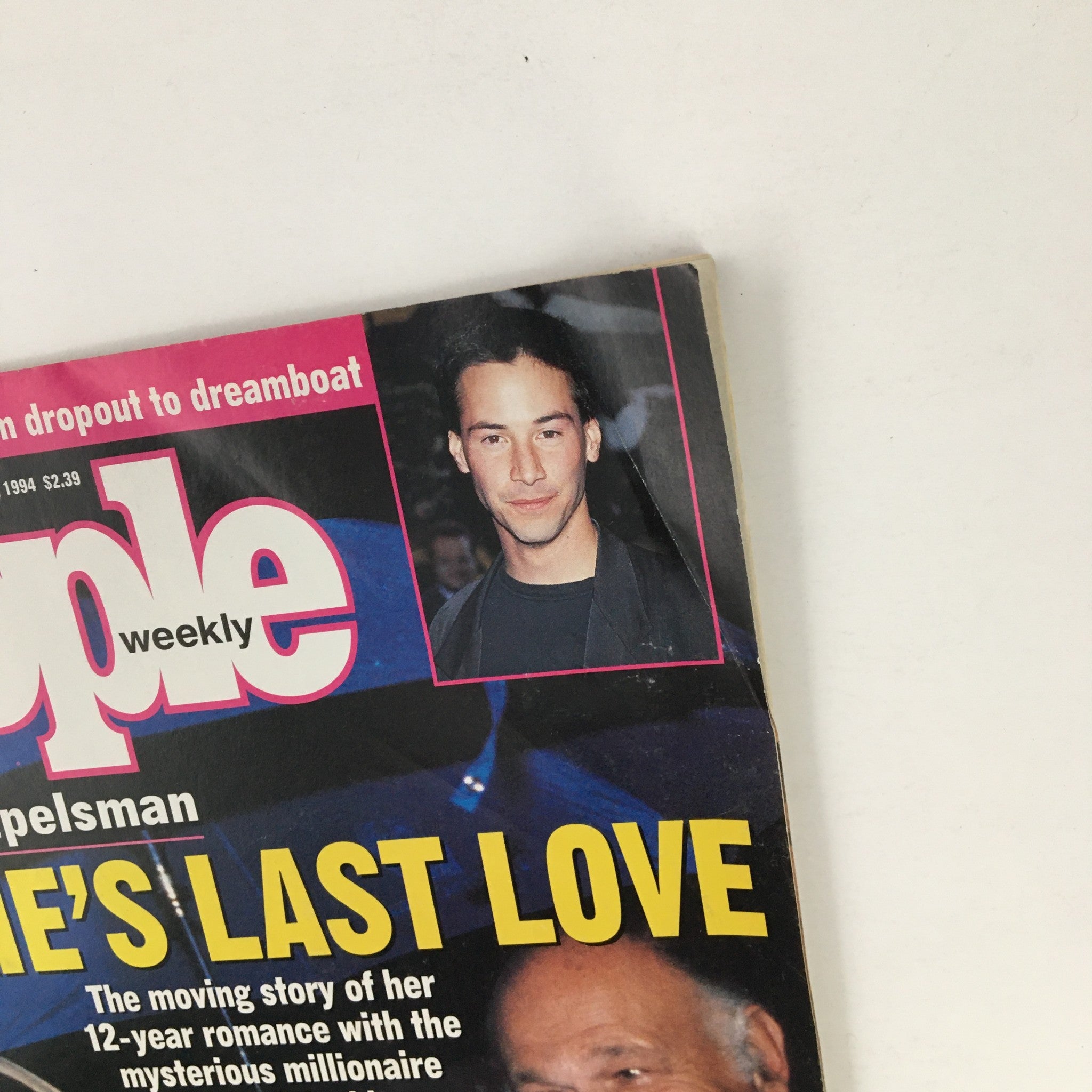 Close-up view of the cover of People Weekly Magazine July 11, 1994, showcasing Jackie Onassis and a small image of Keanu Reeves, with a focus on the title 'Jackie's Last Love'.
