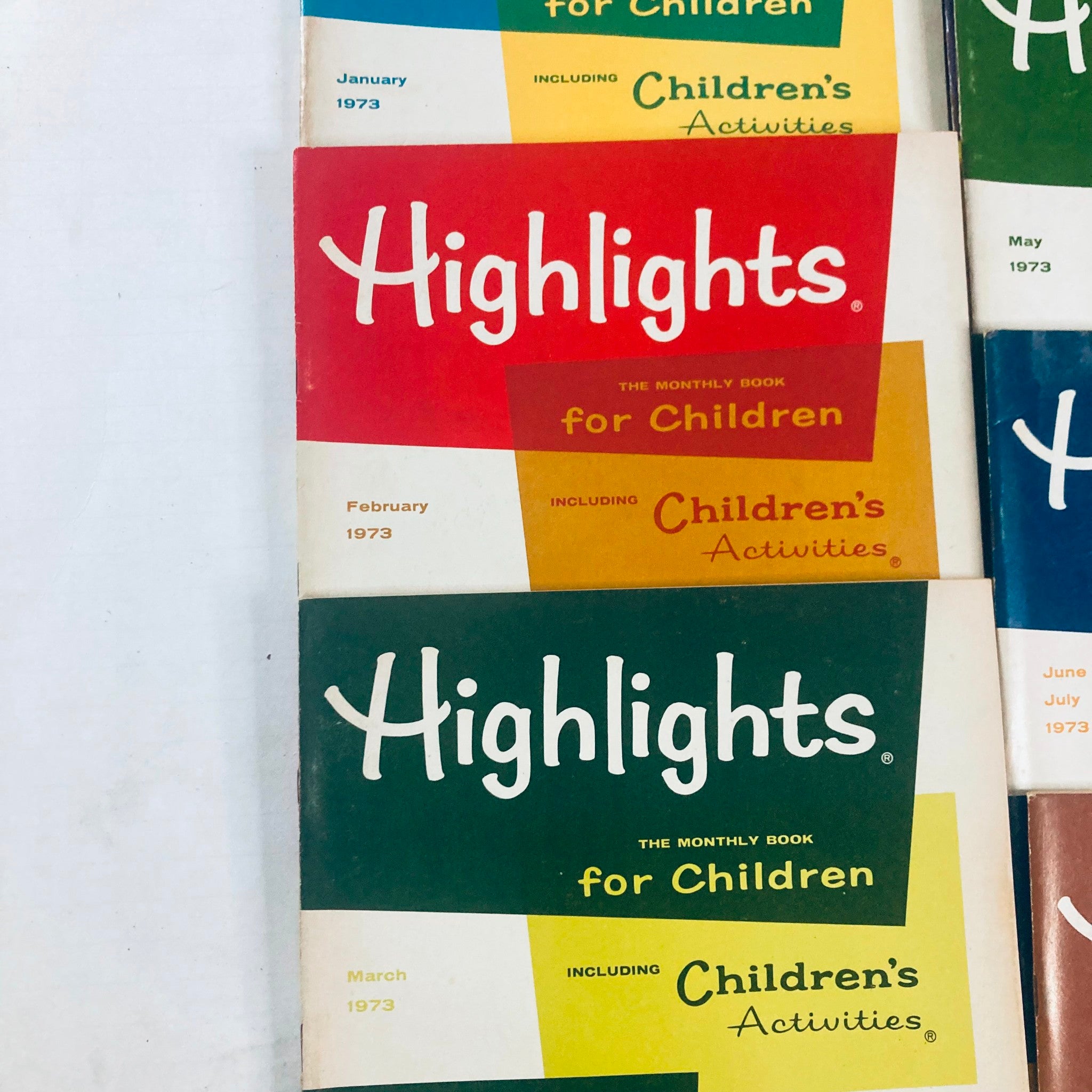 Lot of 10 1973 Highlights for Children Magazine featuring January, February, and March issues with colorful covers.