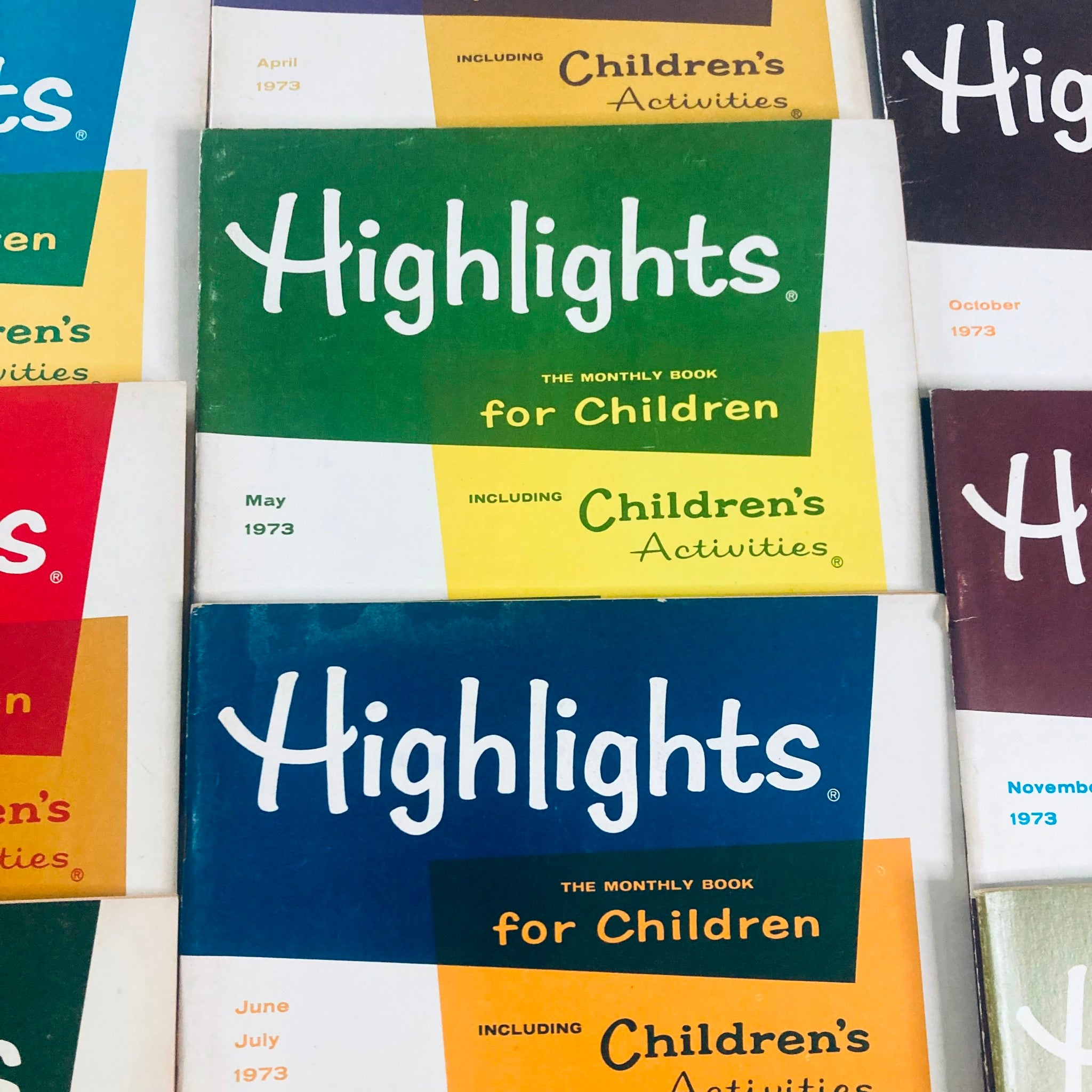 Lot of 10 1973 Highlights for Children Magazine showcasing April, May, June, and July issues with vibrant illustrations.