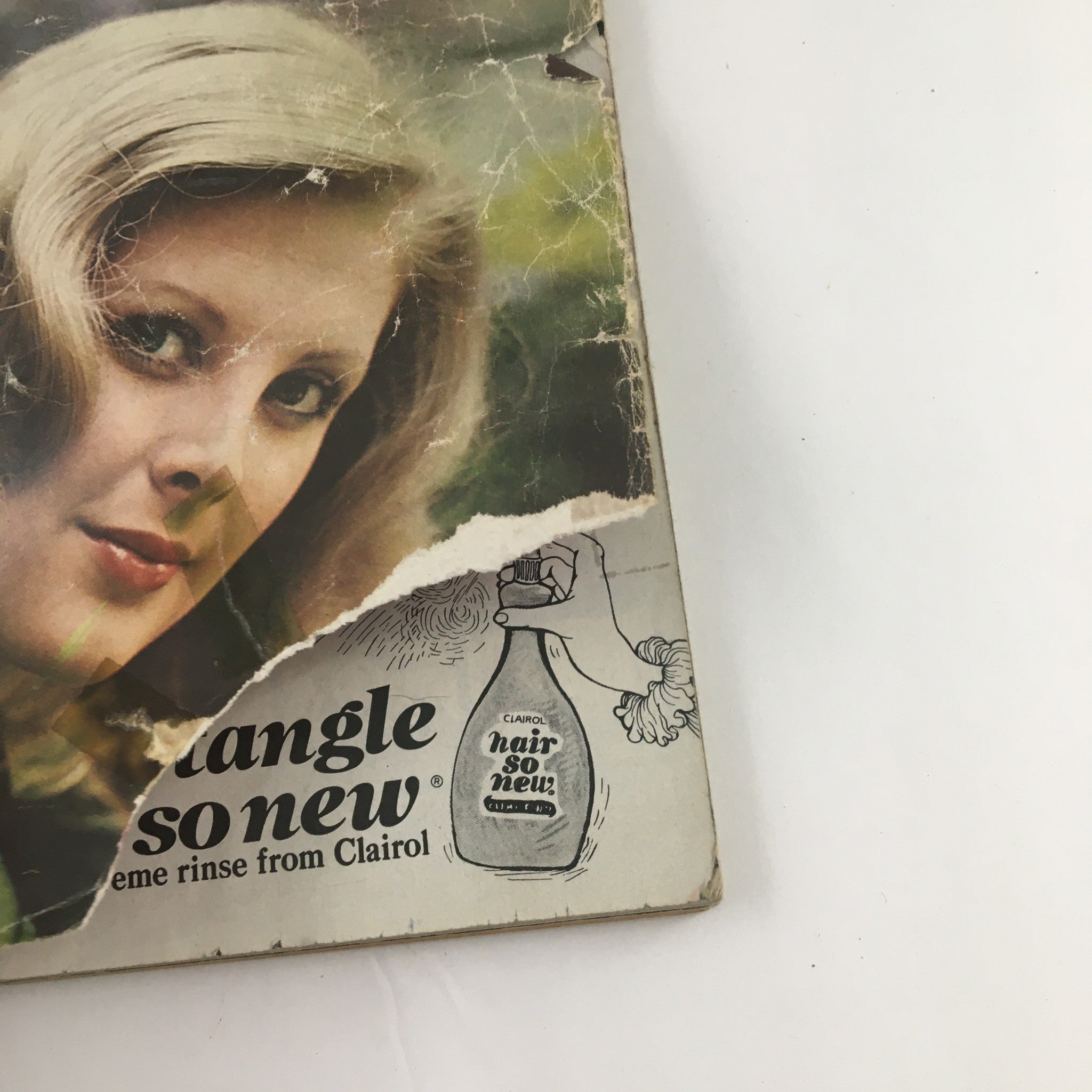Partial view of Good Housekeeping Magazine October 1972 cover focusing on the hair product advertisement and the main cover photo.