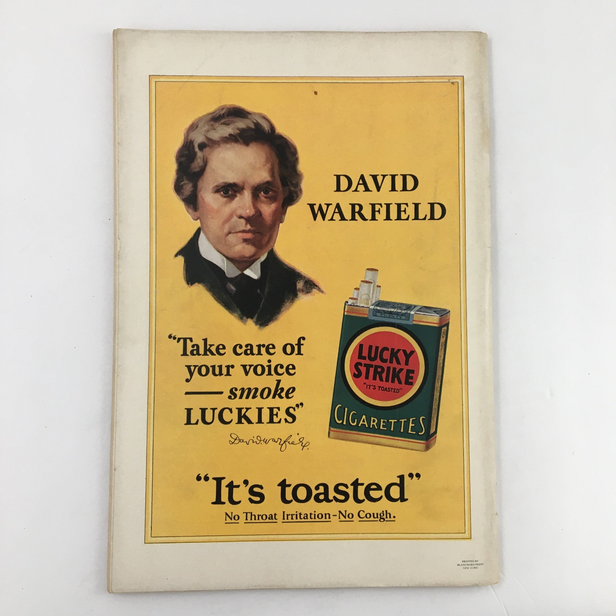 VTG The Spur Magazine January 15 1928 - A vintage advertisement featuring David Warfield promoting Lucky Strike cigarettes with a bright yellow background and portrait.