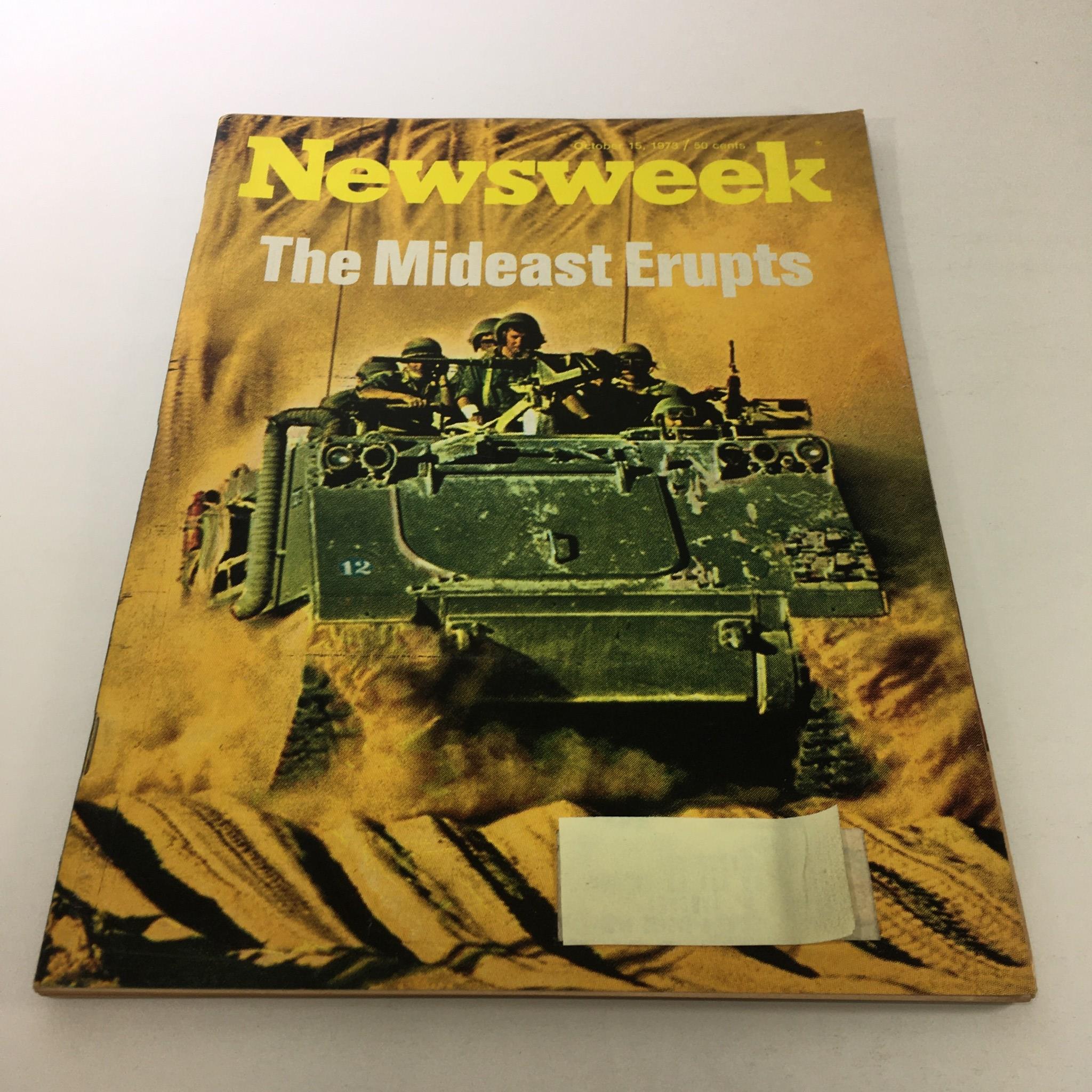 Vintage Newsweek Magazine from October 15, 1973, titled 'The Mideast Erupts', featuring a striking cover image depicting soldiers in an armored vehicle amidst a dramatic backdrop of desert terrain.