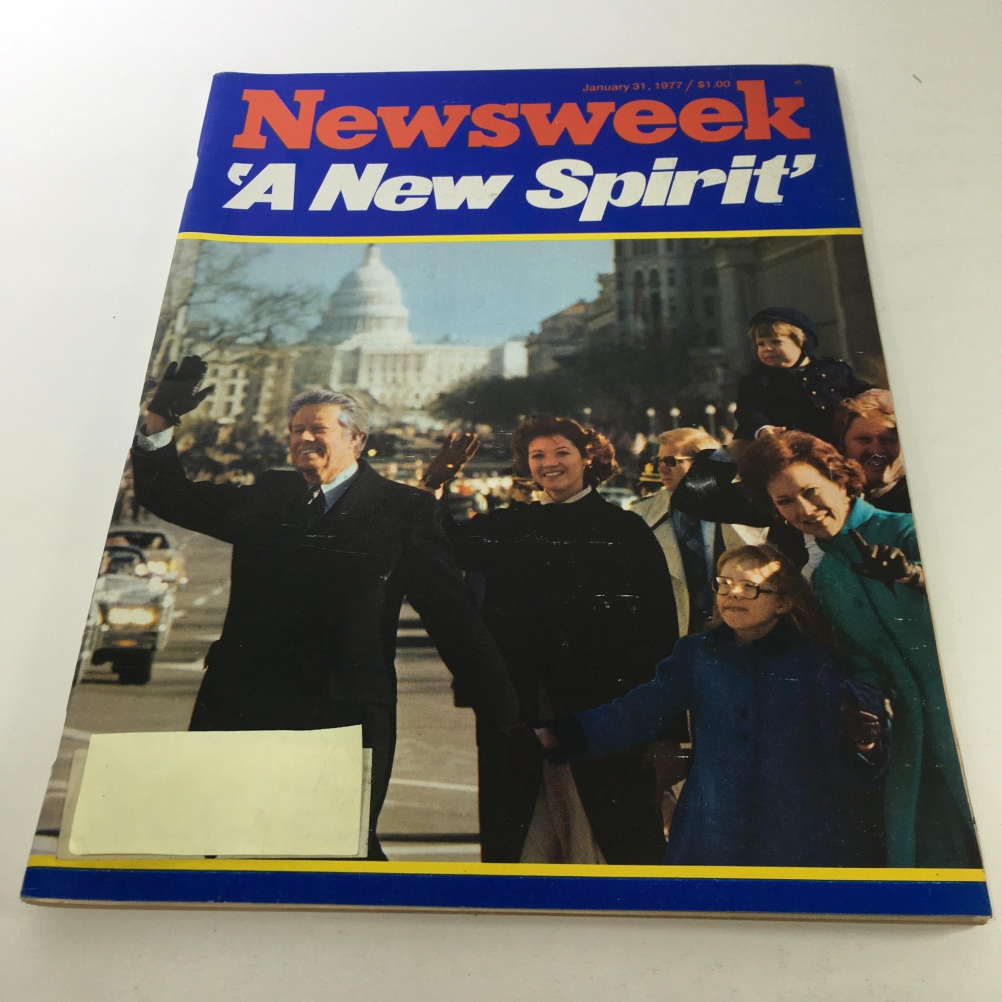 Cover of Newsweek Magazine from January 31, 1977 featuring the title 'A New Spirit', showcasing a political event with people waving and the U.S. Capitol in the background. Vintage magazine cover reflecting 1970s culture.