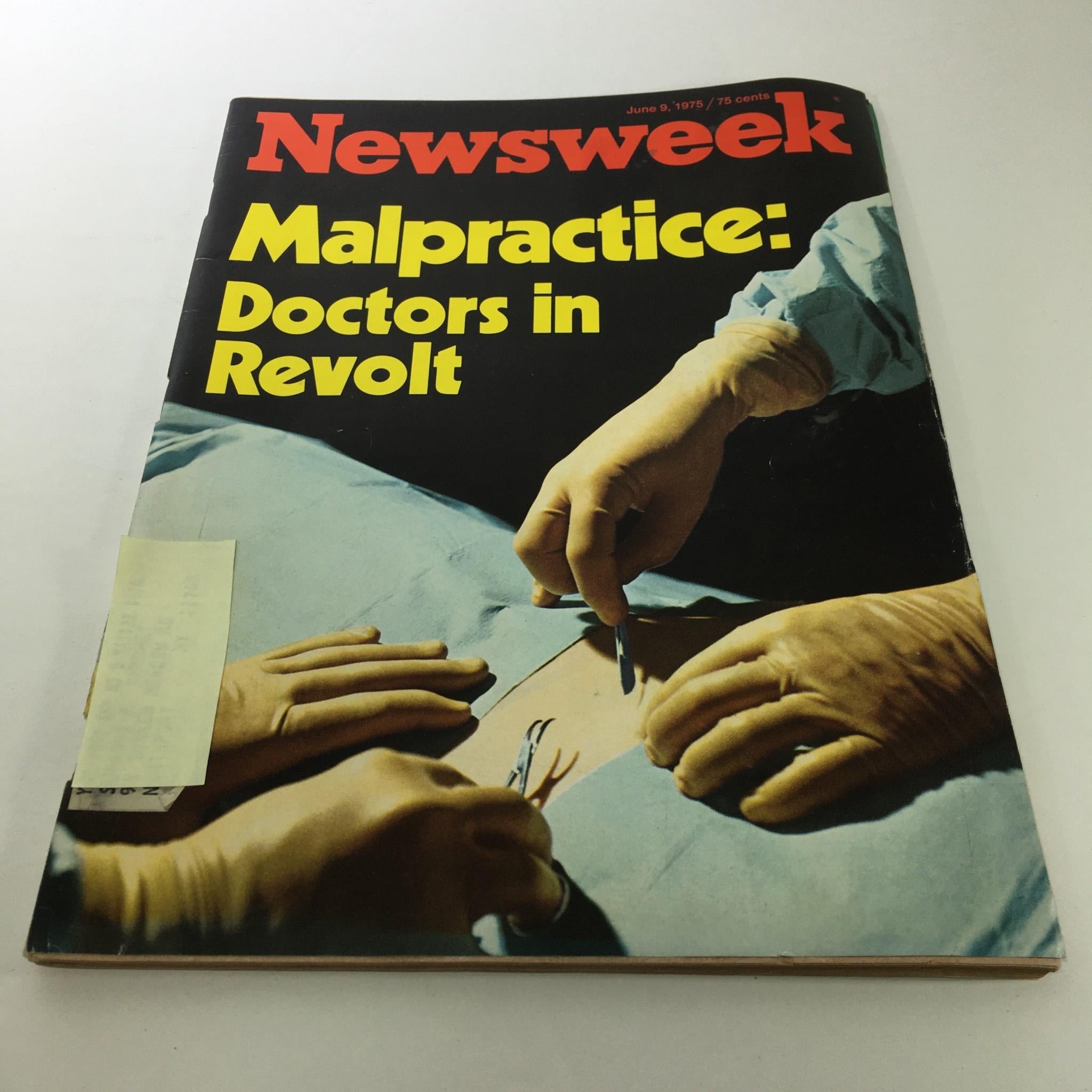 Cover of the vintage Newsweek Magazine dated June 9, 1975, featuring the title 'Malpractice: Doctors in Revolt'. The image shows a surgical scene with doctors' hands and surgical tools, highlighting the discussion on medical malpractice.