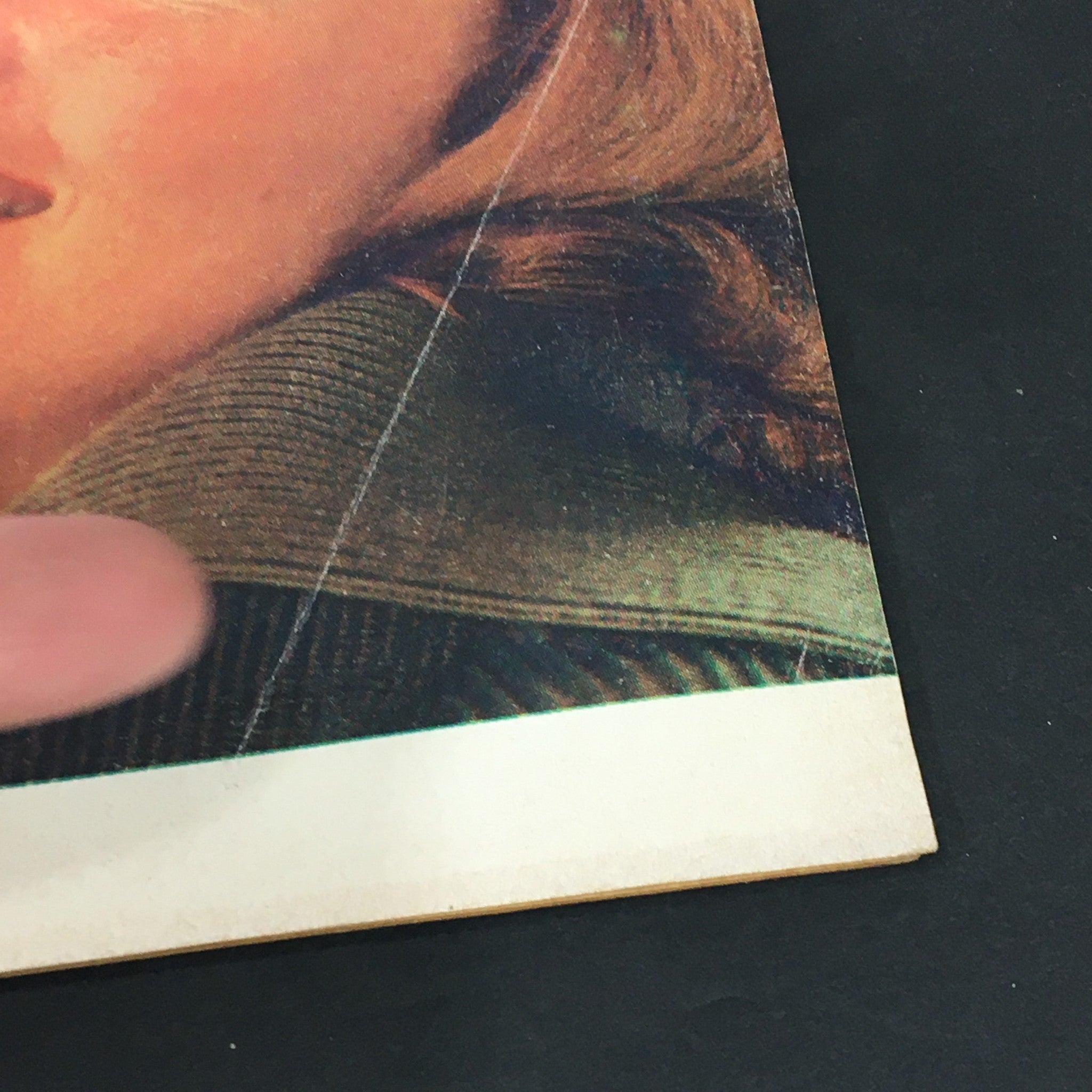 Close-up of the front cover of VTG Love Stories Magazine June 1974 highlighting the woman's face and folded crease, demonstrating the aged vintage condition.