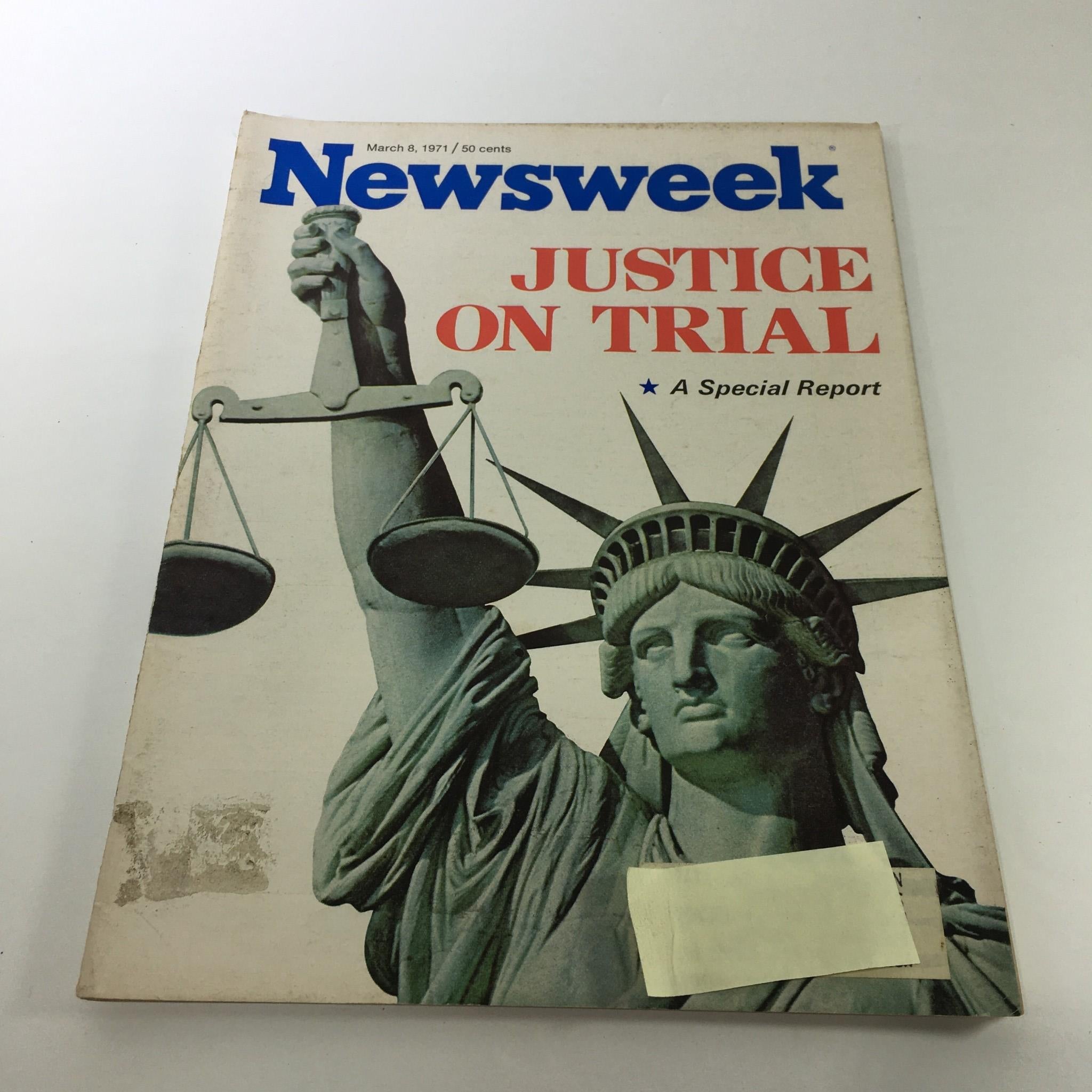 Cover of Newsweek Magazine from March 8, 1971, featuring a dramatic illustration of the Statue of Liberty holding a scale, titled 'Justice On Trial - A Special Report'. This vintage magazine showcases pivotal moments in the legal system during a transformative era in American history.