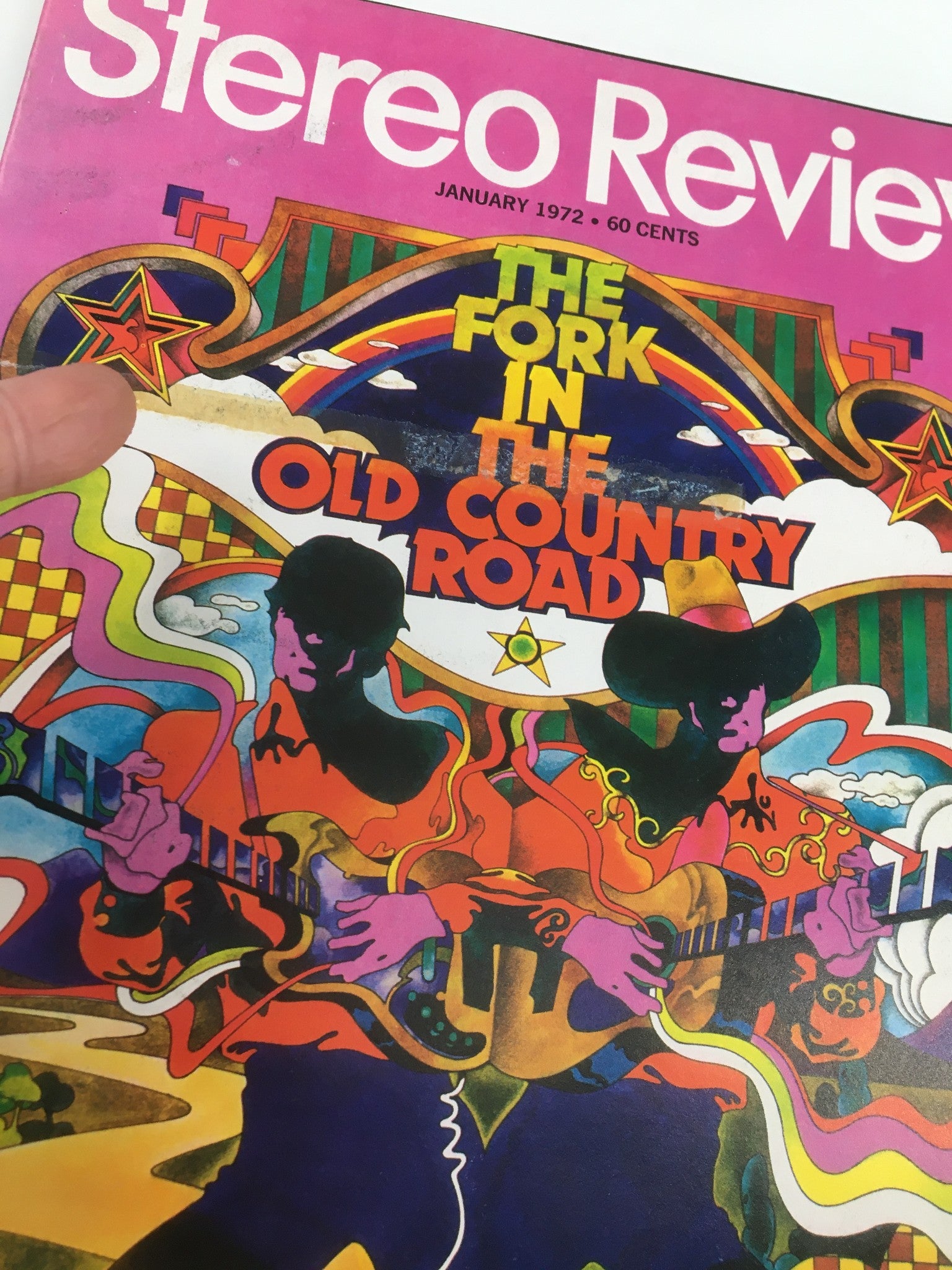 Close-up of Vintage Stereo Review Magazine January 1972 cover titled "The Fork in The Old Country Road" highlighting colorful illustrations of musicians.