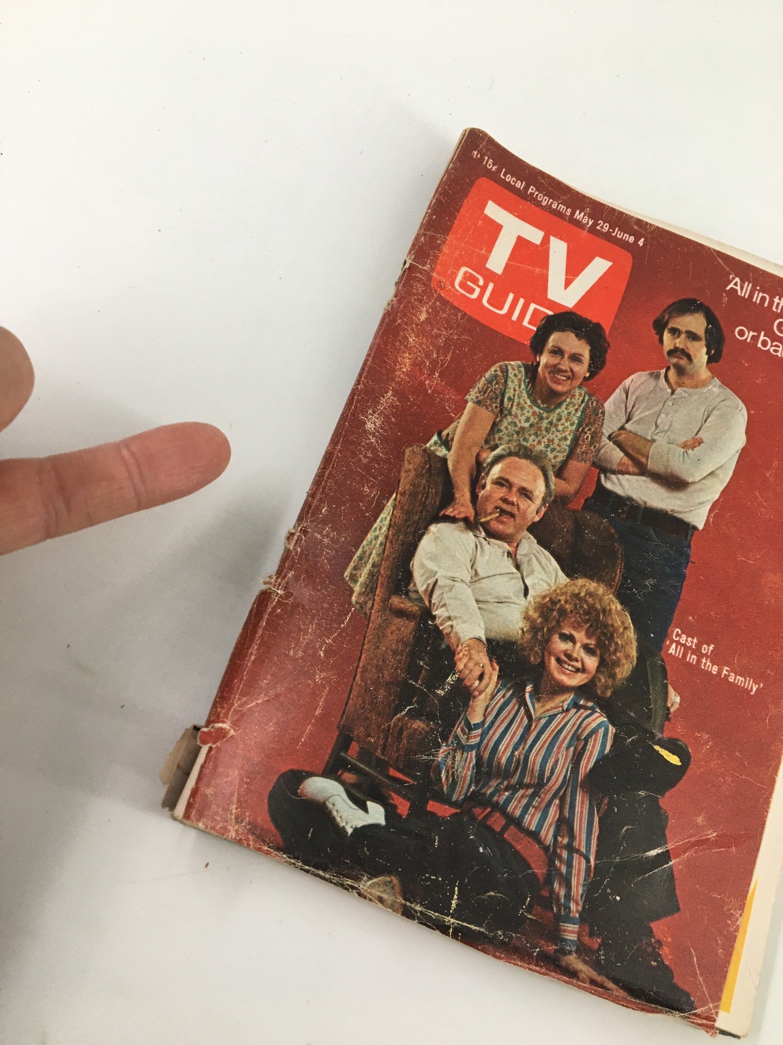 Side view of TV Guide Magazine May 29 1971 highlighting the cover of All In The Family and indicating the magazine's age with visible wear.