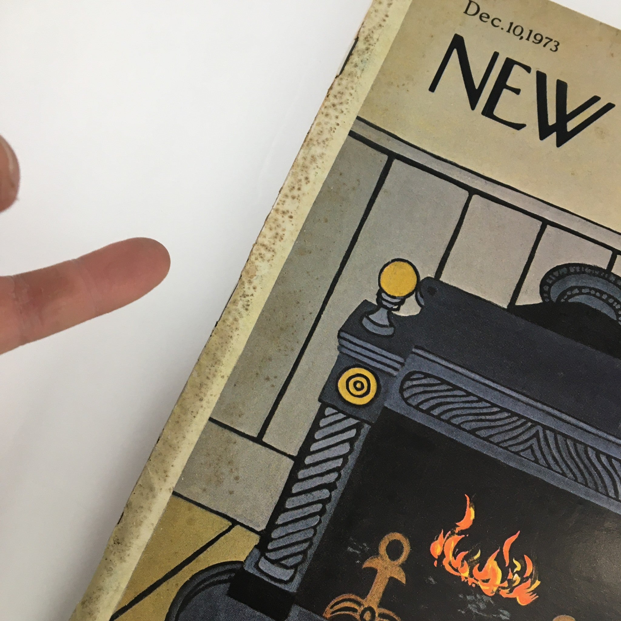 Close-up view of the fireplace cover detail from The New Yorker Magazine December 10, 1973, designed by Charles E. Martin, showcasing its vintage charm.