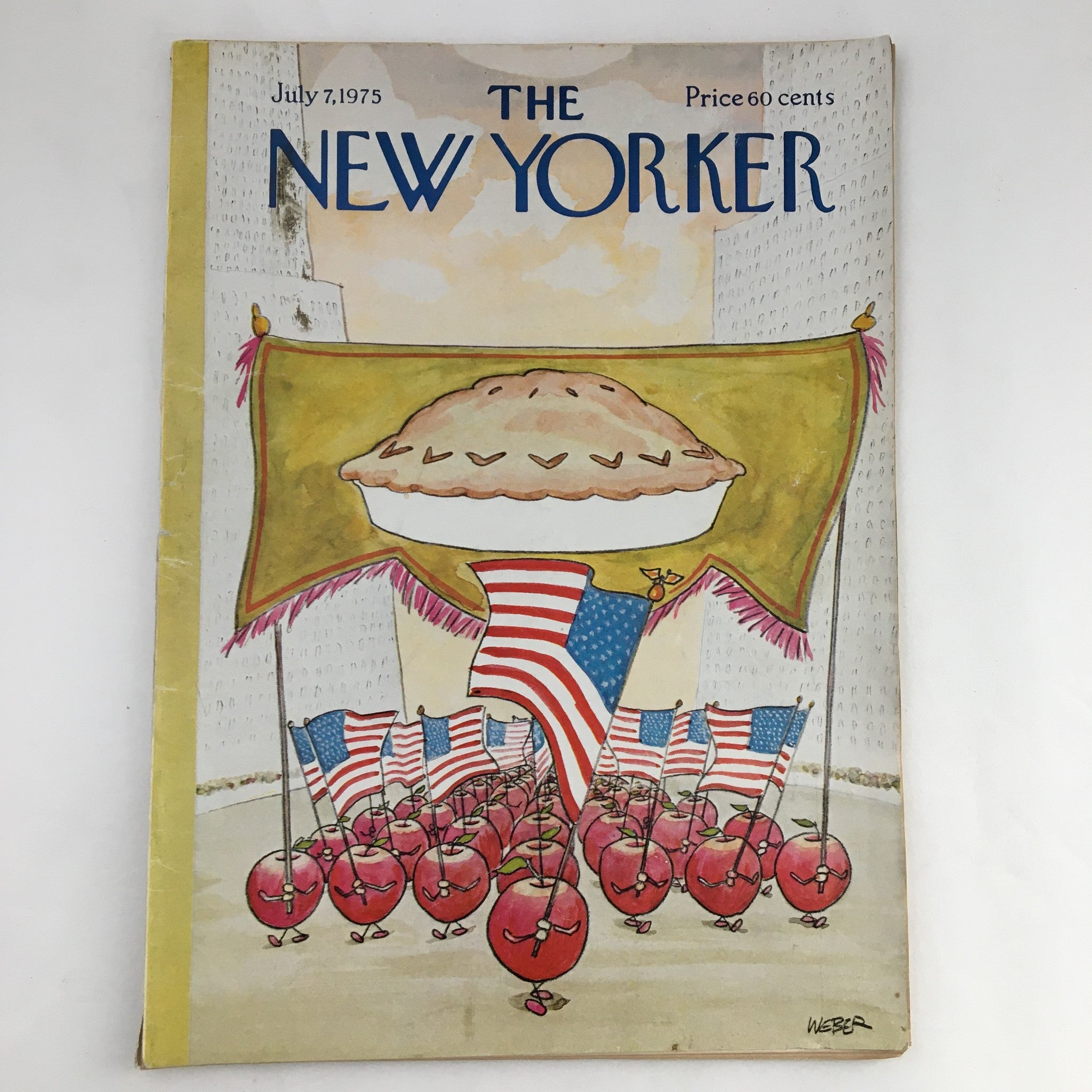The New Yorker Magazine July 7 1975 The Apple Pie March featuring a whimsical illustration of marching apples with flags and a giant apple pie on the cover.