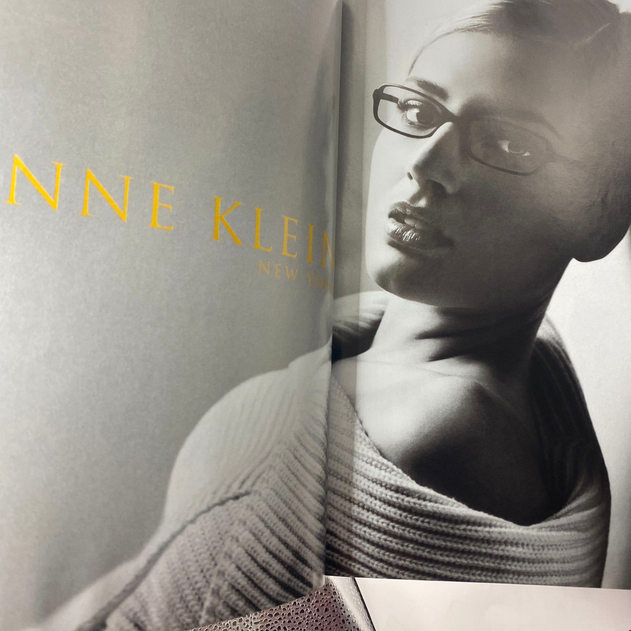 Black and white fashion spread from the October 2004 Elle Magazine showcasing modern women's wear by Anne Klein.