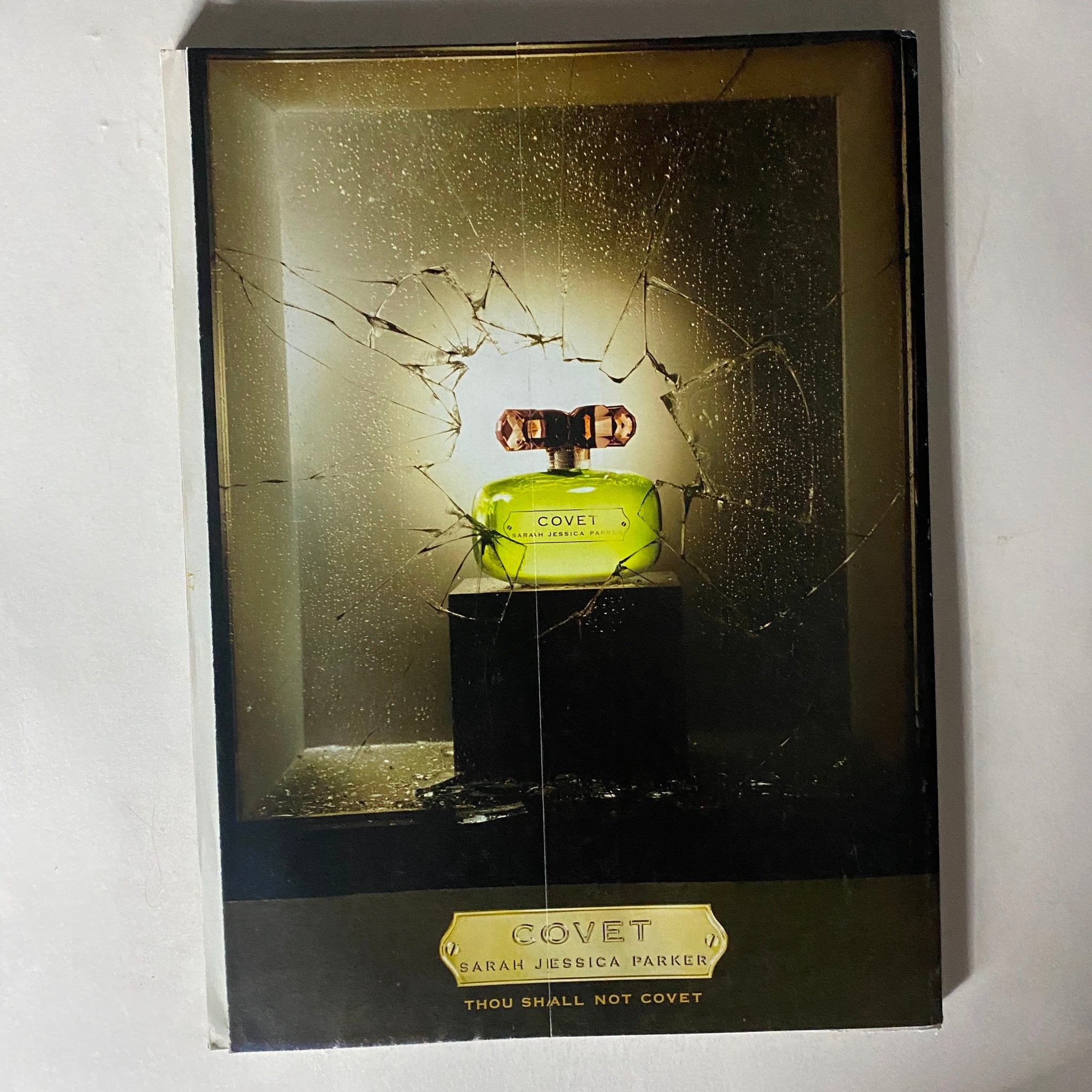 Back cover of Elle Magazine August 2007 featuring the advertisement for Sarah Jessica Parker's fragrance 'Covet' with an artistic shattered glass presentation.