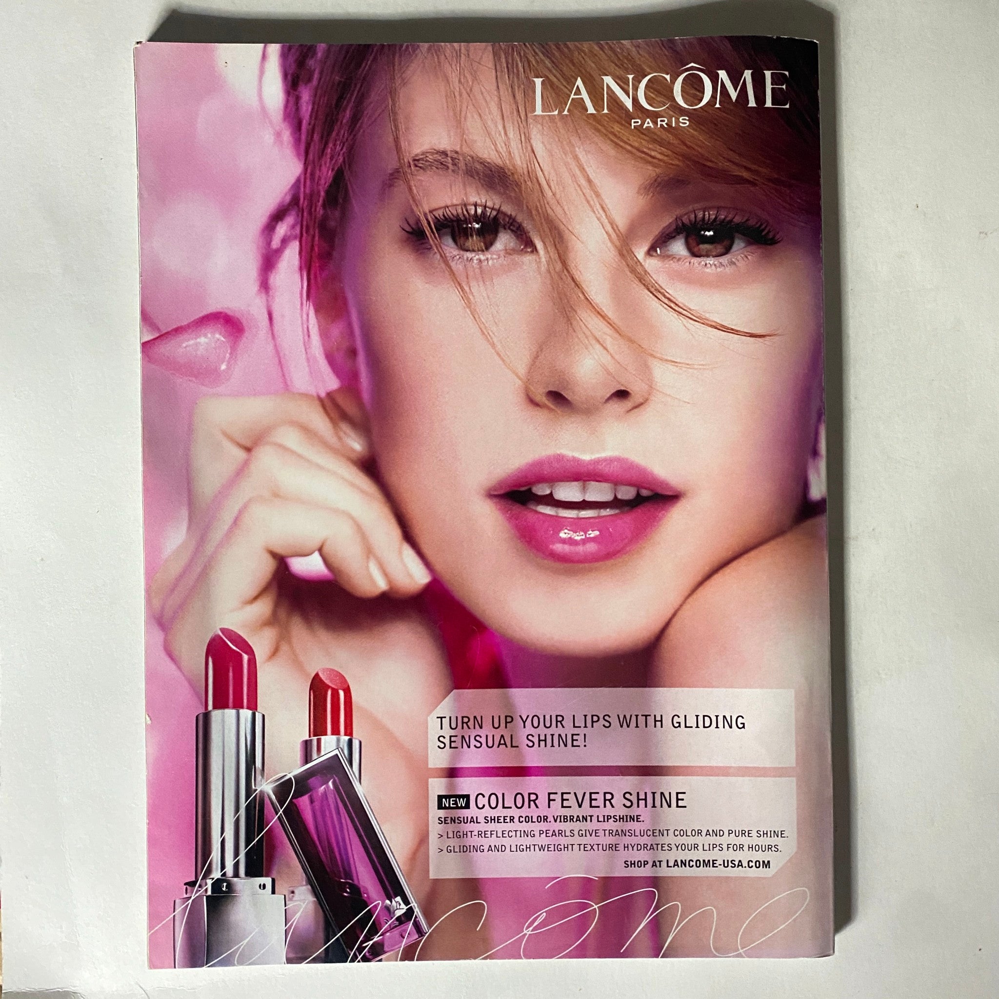 Elle Magazine July 2007 Kelly Clarkson Cover featuring an advertisement for Lancôme lip products highlighting vibrant shades and beauty tips.