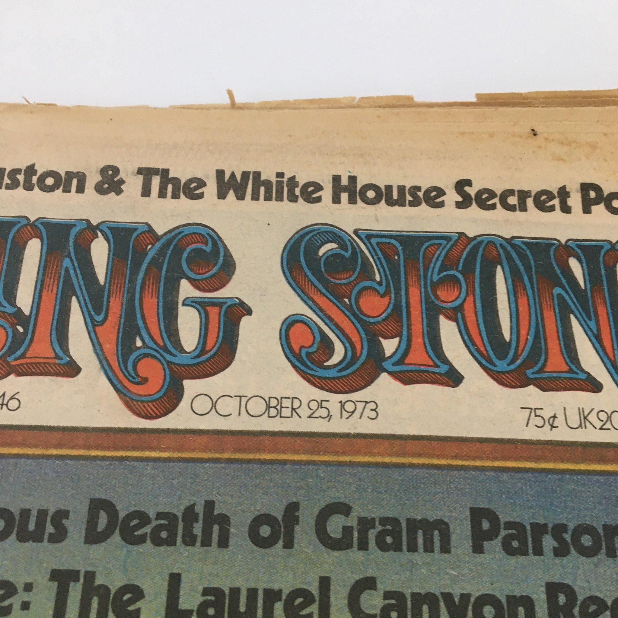 Close-up of the header from the October 25, 1973 issue of Rolling Stone Magazine, featuring prominent headlines about music legends, including Gene Autry, and displaying distinctive vintage typography.