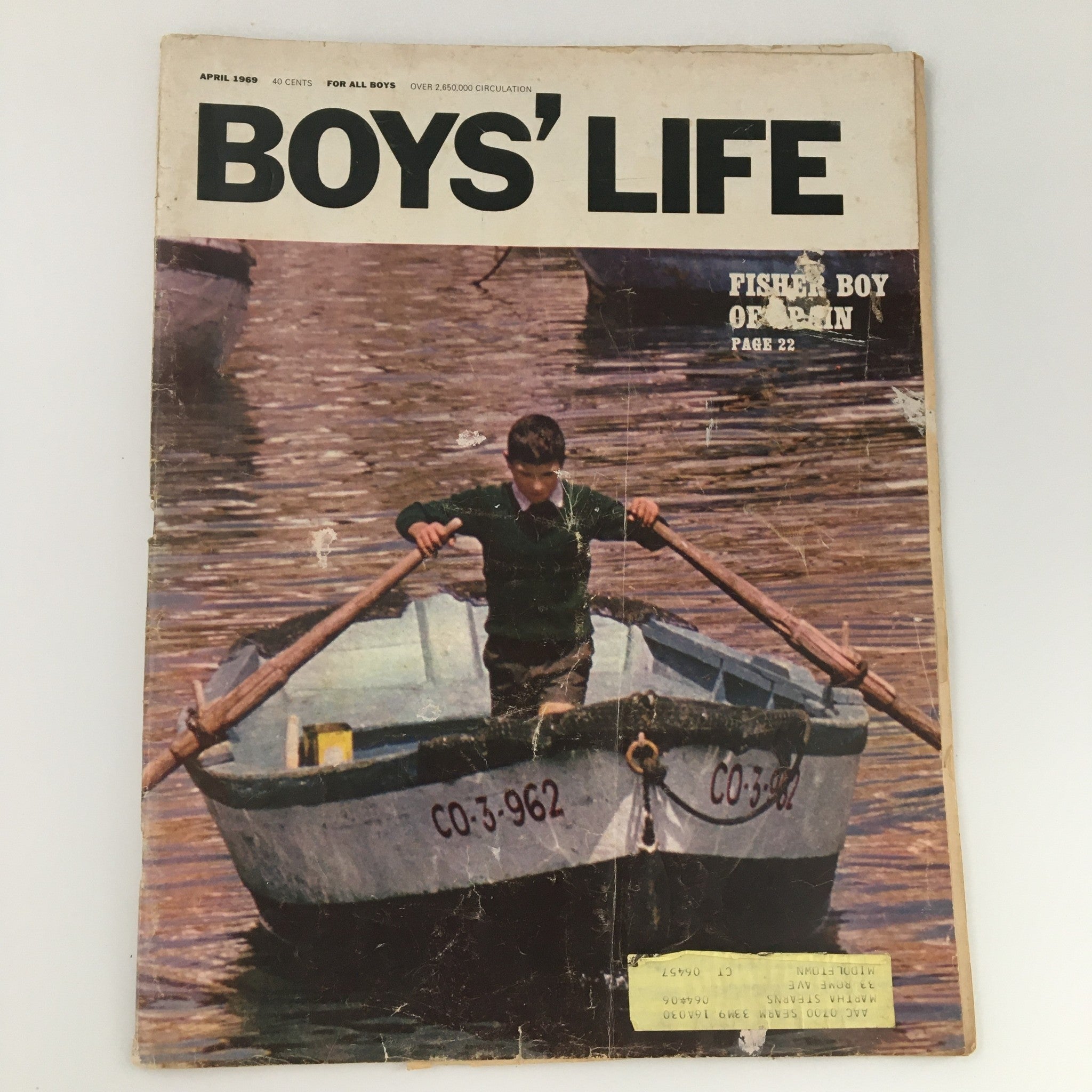 Cover of the April 1969 issue of Boys' Life Magazine featuring a Fisher Boy orphan, with a young boy rowing a boat on calm waters, showcasing vintage design and nostalgic charm.