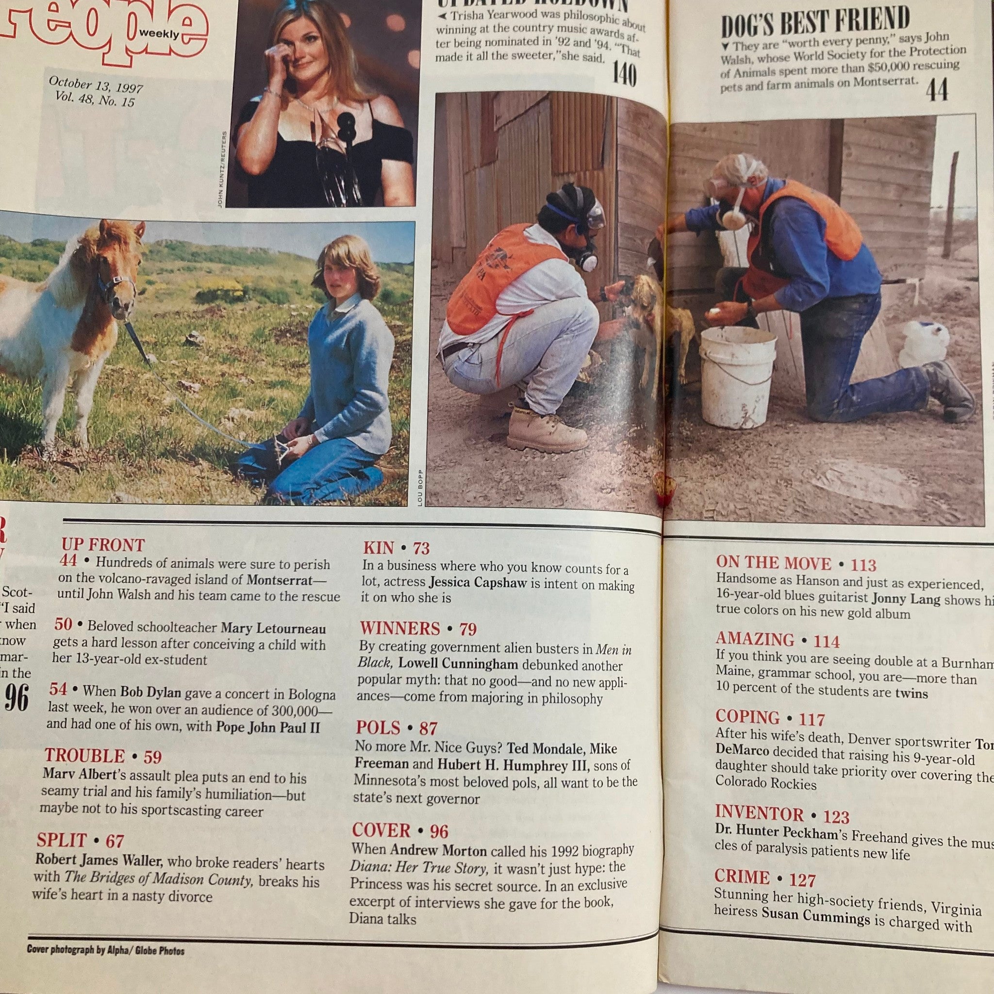 Inside page of People Weekly Magazine, October 13, 1997, showcasing various articles including 'Dog's Best Friend' and other features alongside pictures of individuals involved in animal rescue efforts.