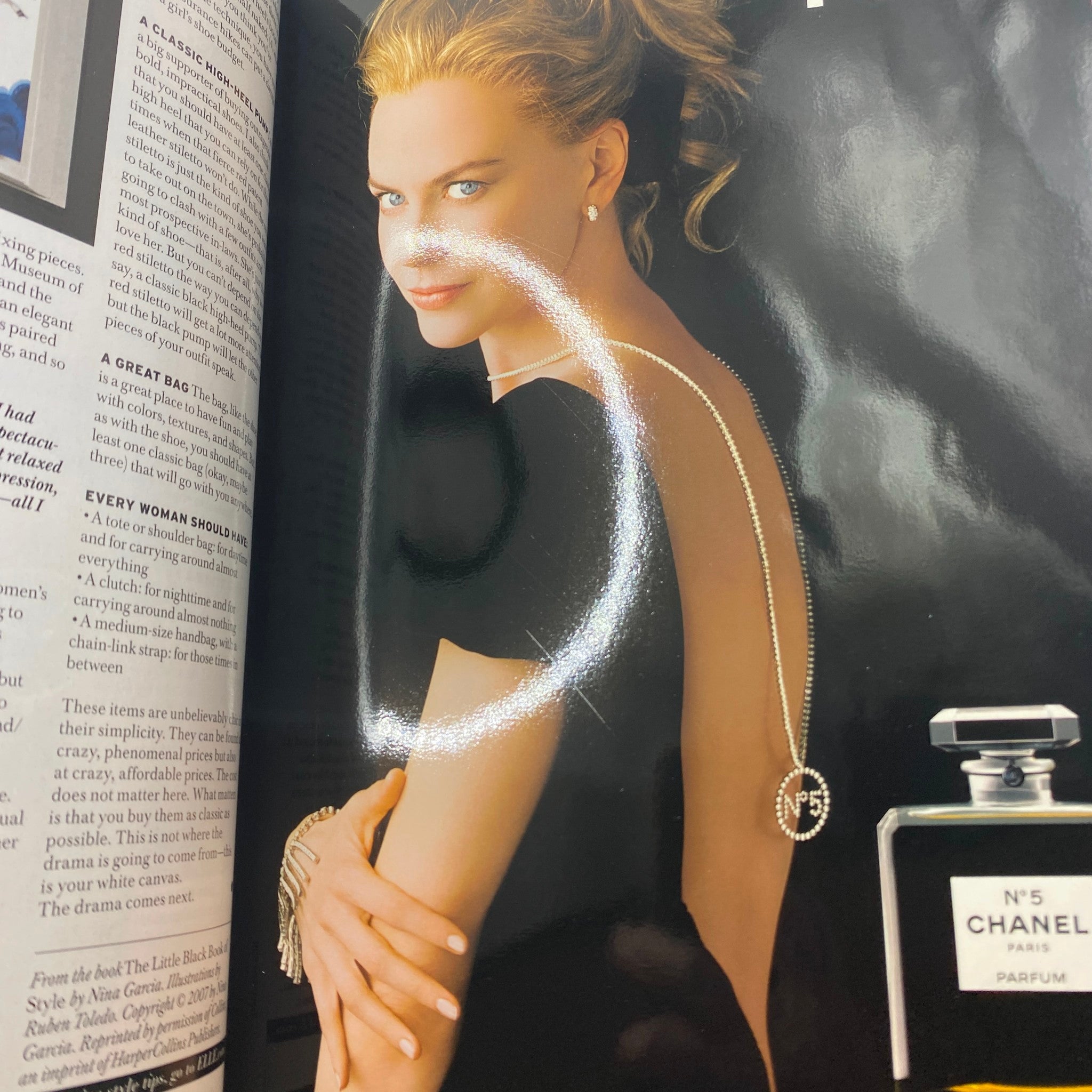 Page from Elle Magazine October 2007 featuring a glamorous photo of a model showcasing Chanel No. 5, illustrating luxury fashion and beauty.