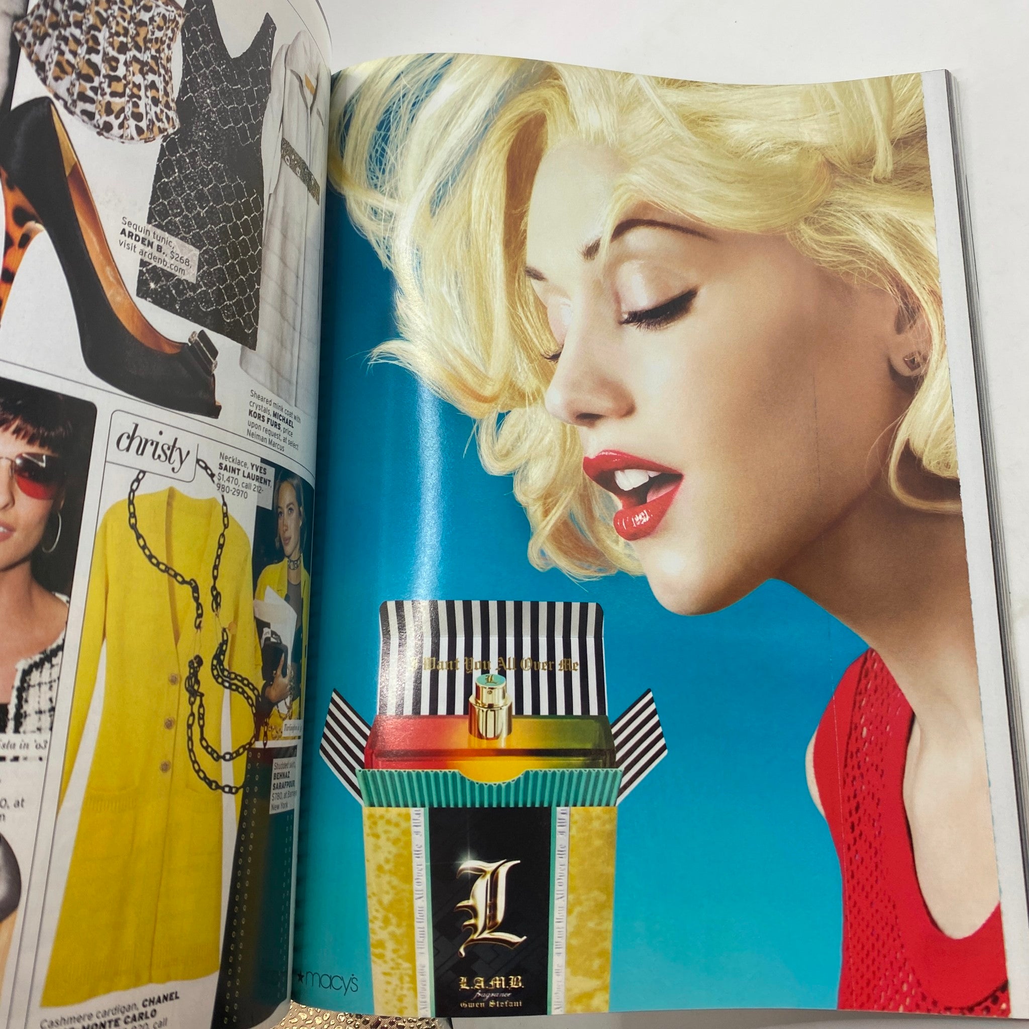 Fashion advertisement page from Elle Magazine October 2007 featuring a glamorous model with blonde hair and a striking red outfit, showcasing a colorful perfume box from L.A.M.A.R. This page highlights the latest trends in beauty and lifestyle for the Personal Style Issue.