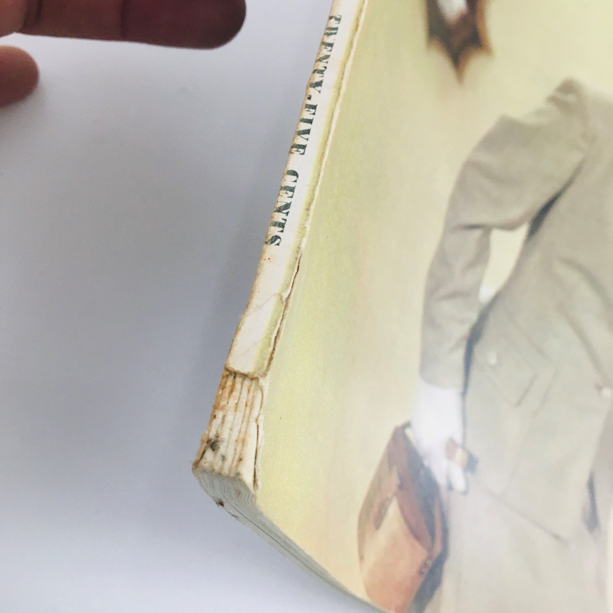 Detail view of the spine of Seventeen Magazine February 1949, showing minor wear and the price 'Twenty-Five Cents', reflecting its vintage condition.