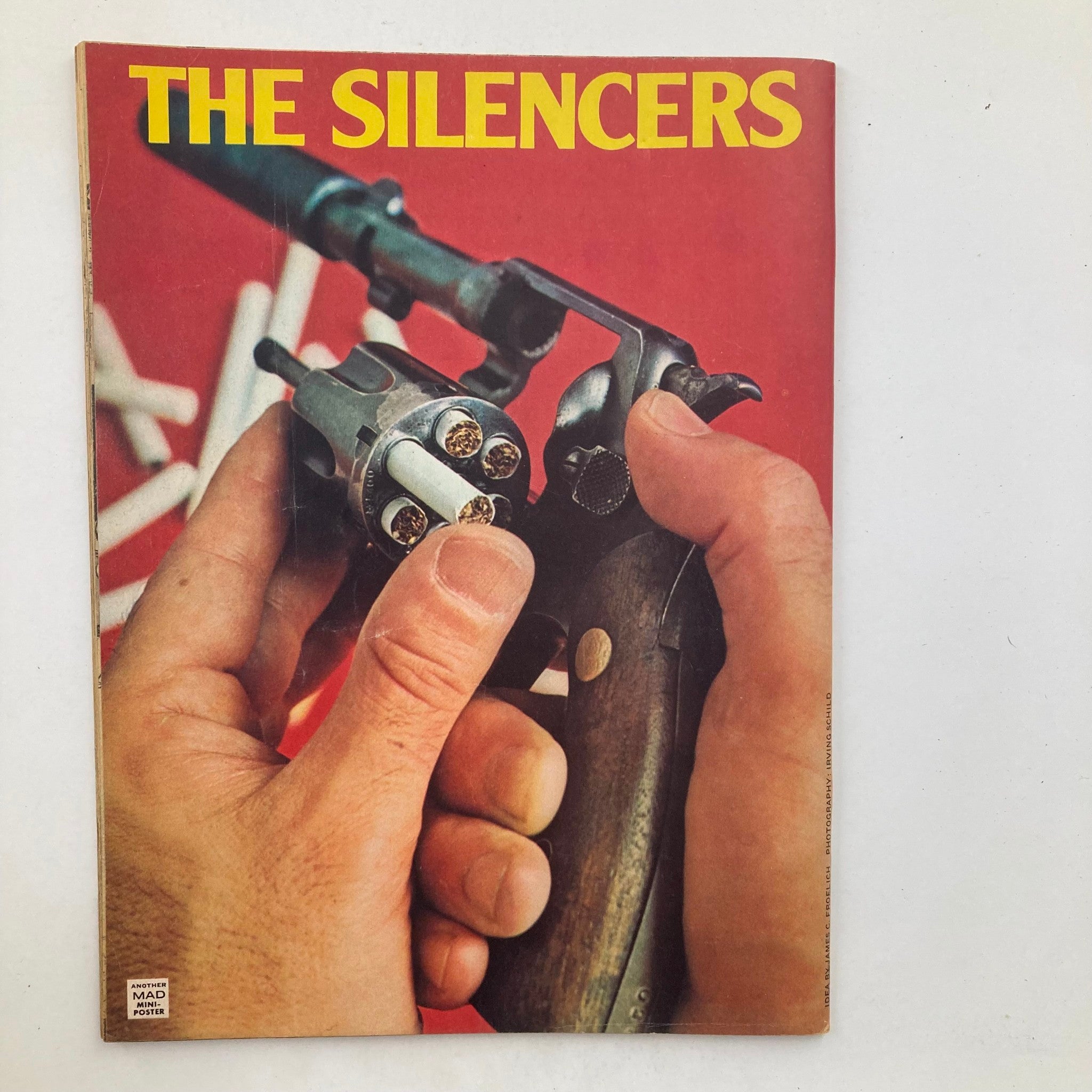 Back cover of Mad Magazine April 1975 No. 174 showcasing a close-up of hands holding a revolver, advertising 'The Silencers'.