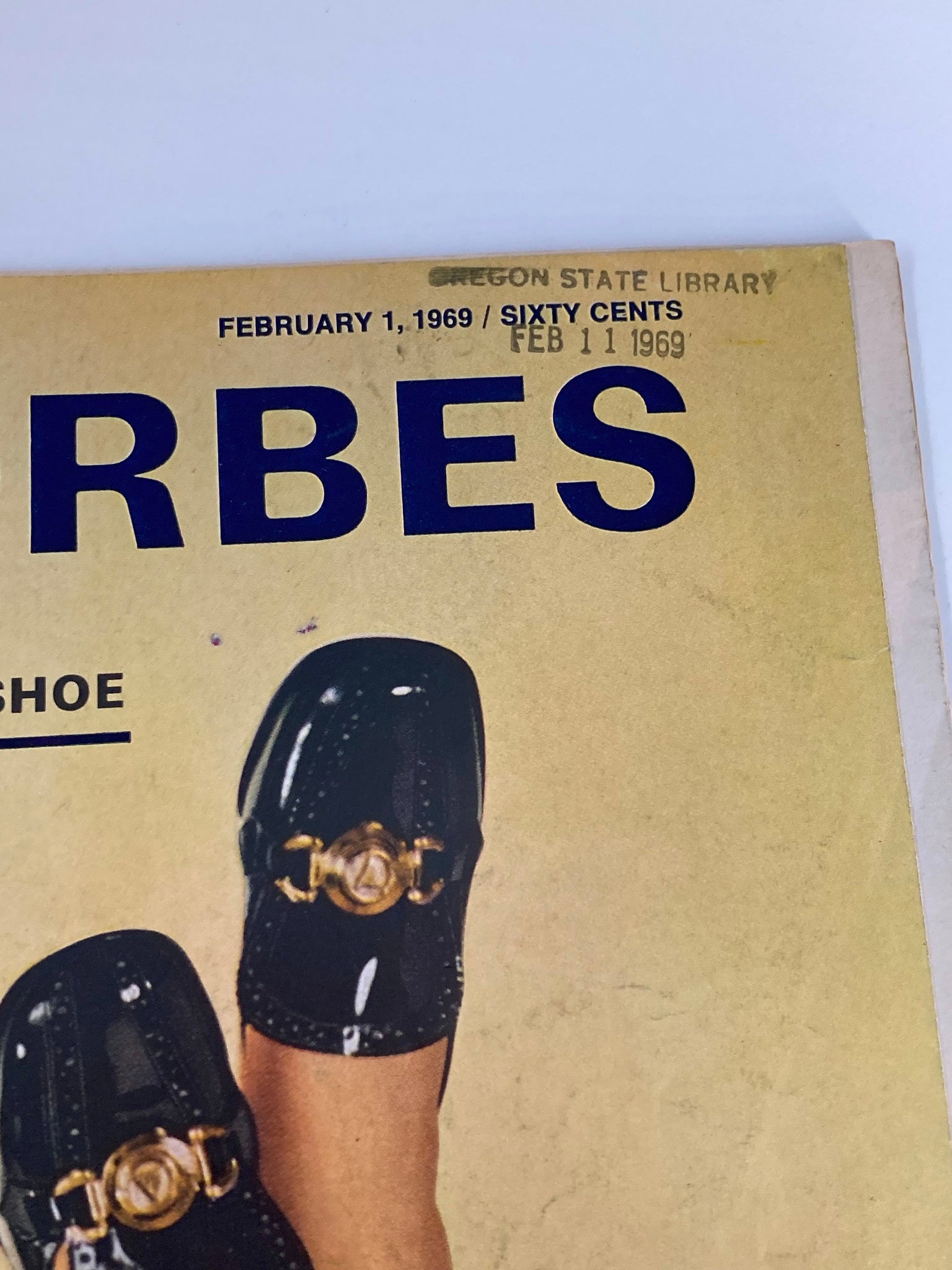 Close-up of the title section of VTG Forbes Magazine February 1, 1969, highlighting its date and content theme of Melville Shoe and Unexpected Glamour.