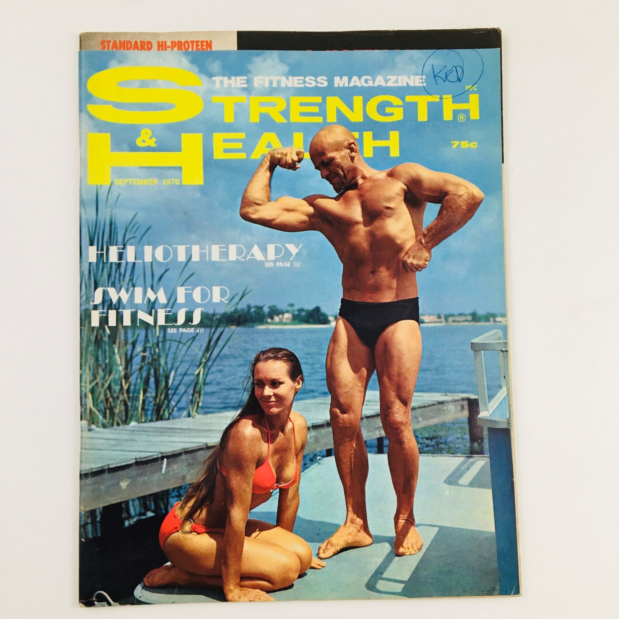 Cover of Strength & Health Magazine September 1970 featuring a bodybuilder flexing with a female model in a swimsuit by the water.